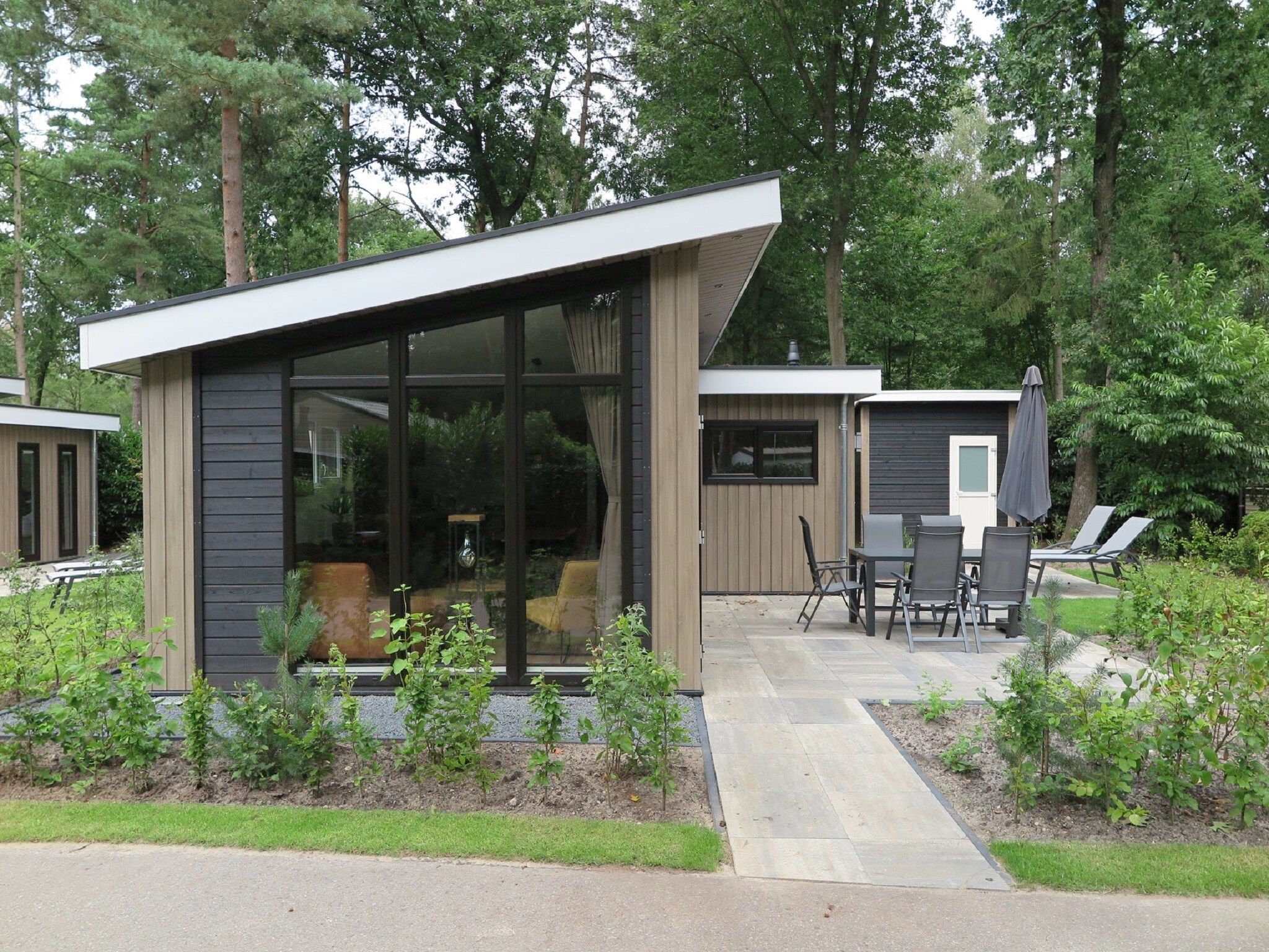 De buitenkant van Vakantiepark De Rimboe & De Woeste Hoogte 25 in Hoenderloo