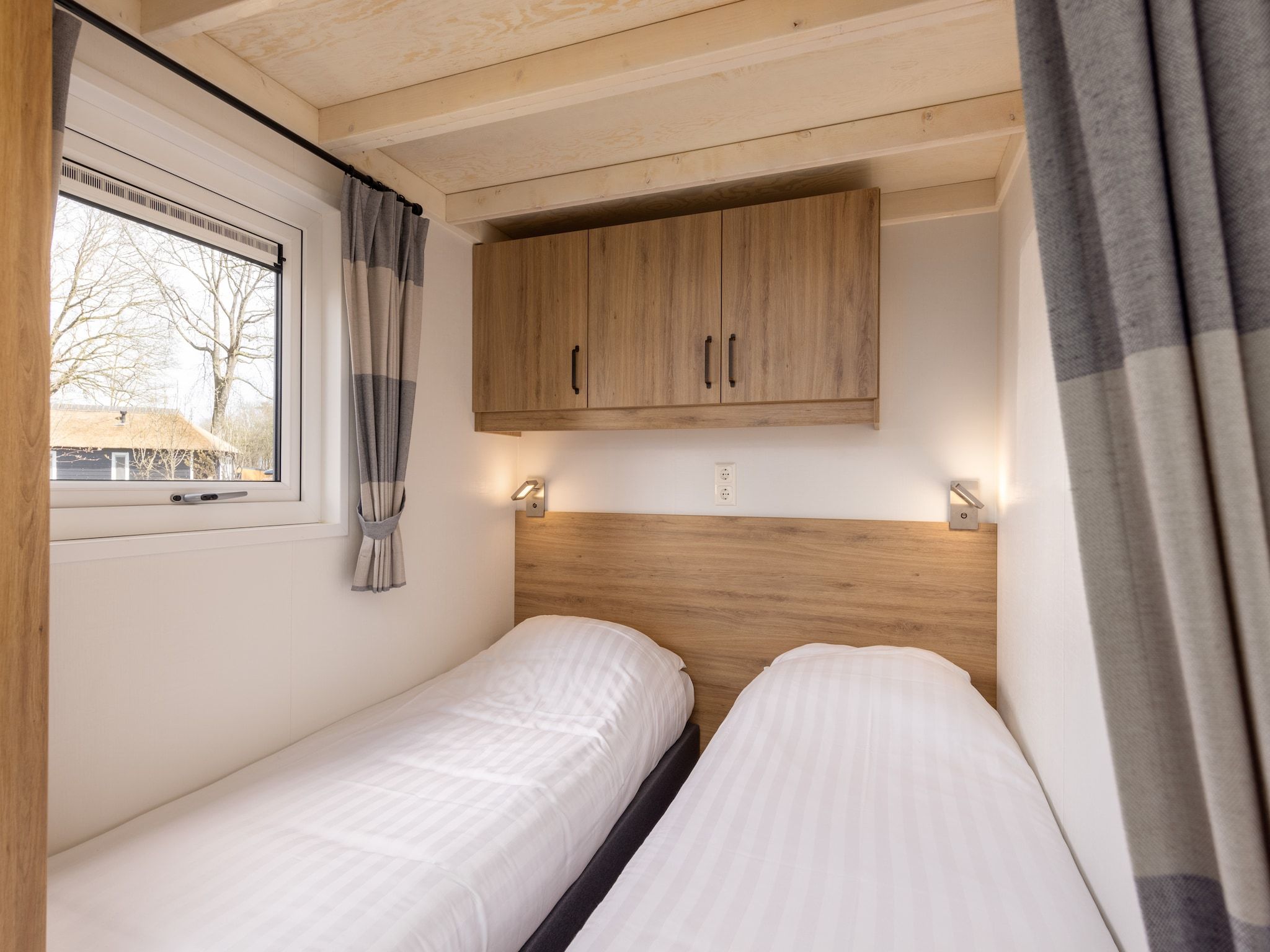 Een slaapkamer van Recreatiepark Tolplas 19 in Hoge Hexel