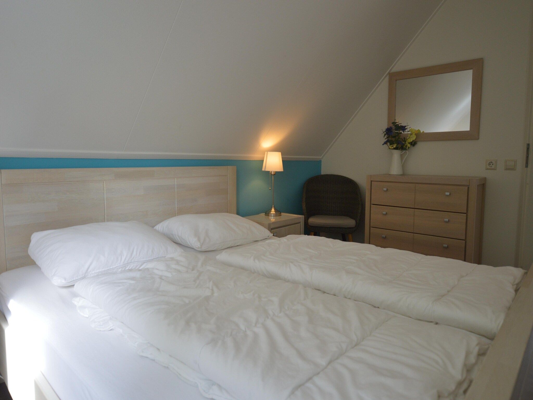 Een slaapkamer van Buitenplaats Berg en Bos nummer 15 in Lemele
