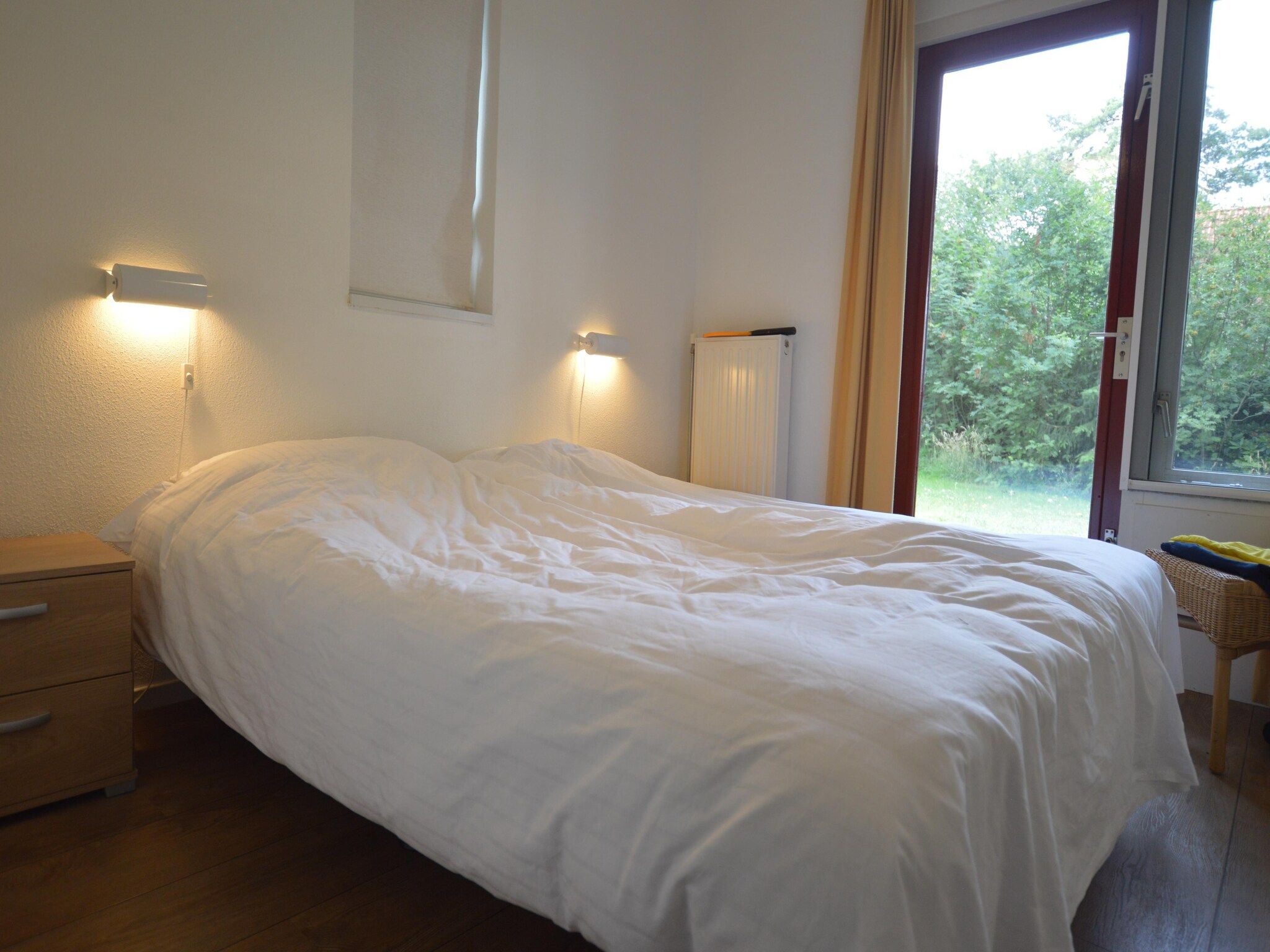 Een slaapkamer van Buitenplaats Berg en Bos nummer 18 in Lemele