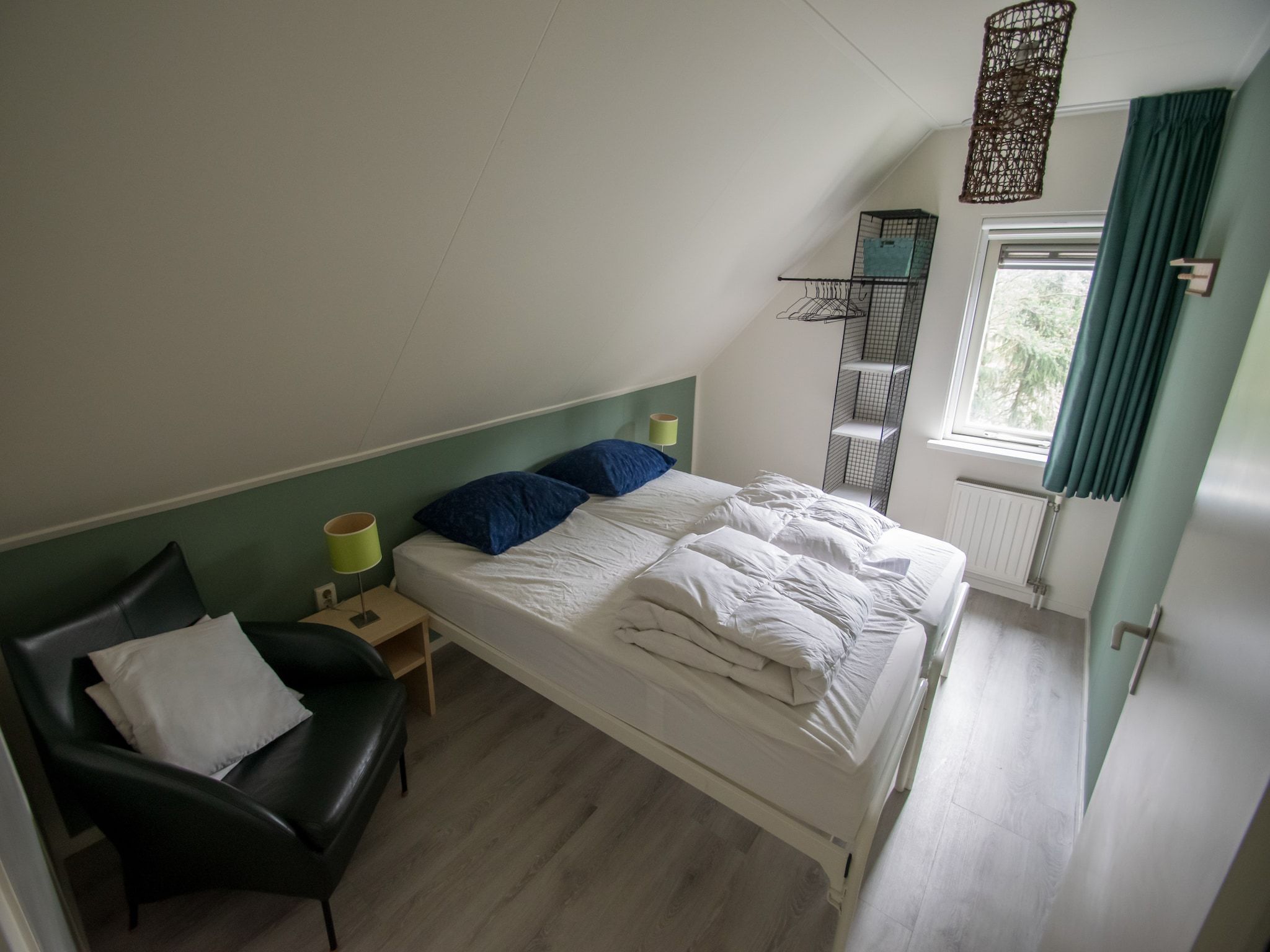 Een slaapkamer van Buitenplaats Berg en Bos nummer 13 in Overijssel