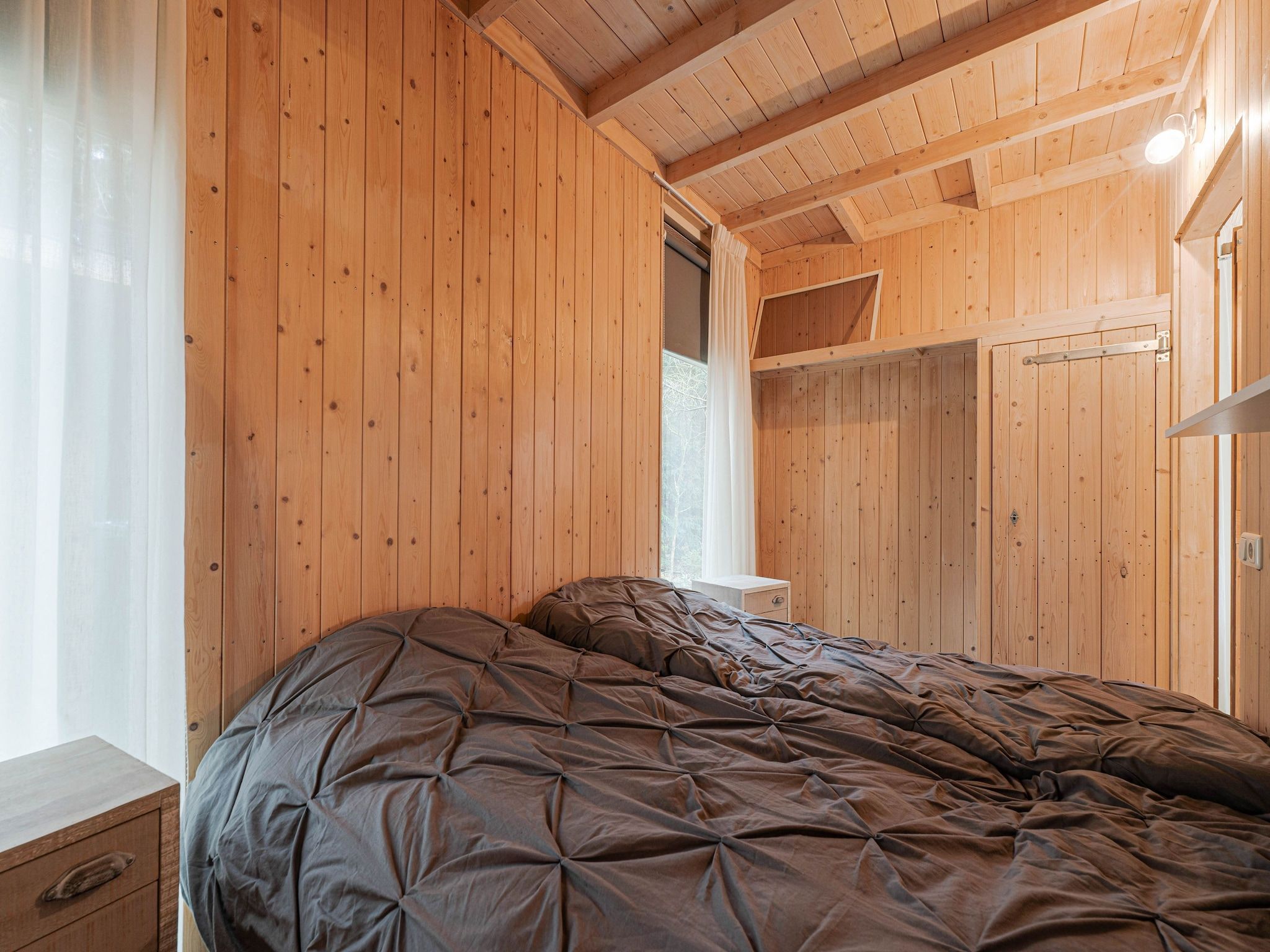 Een slaapkamer van Boshuis De Klim in Norg