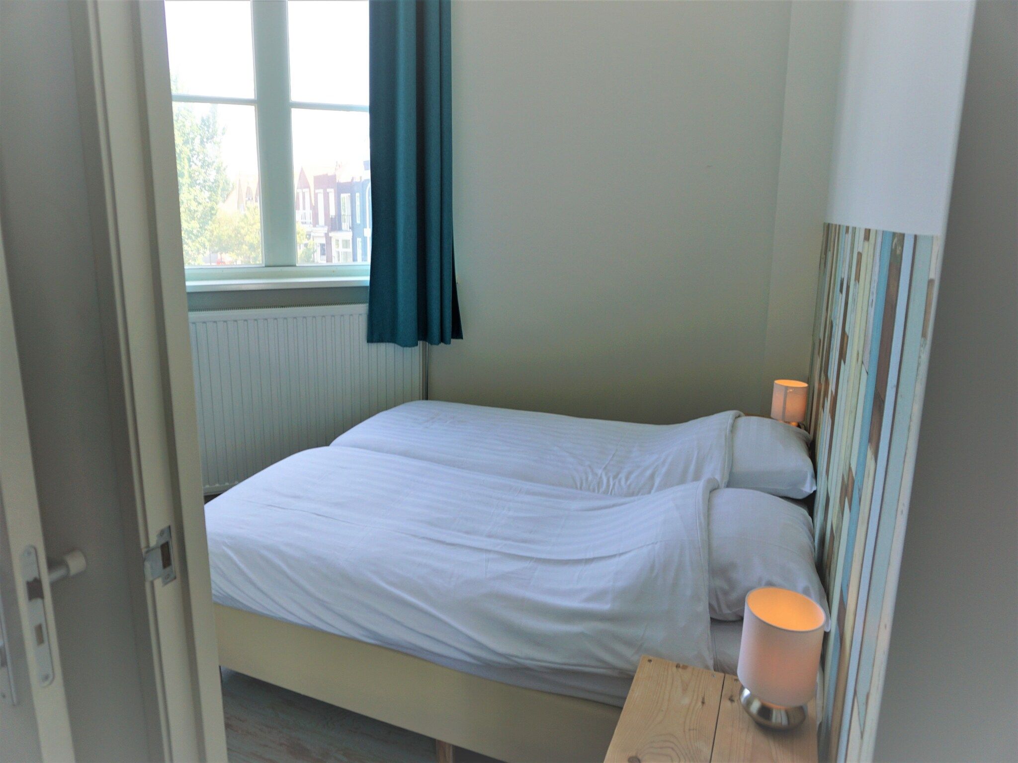 Een slaapkamer van Watertoren Vlissingen 16 pax in Vlissingen