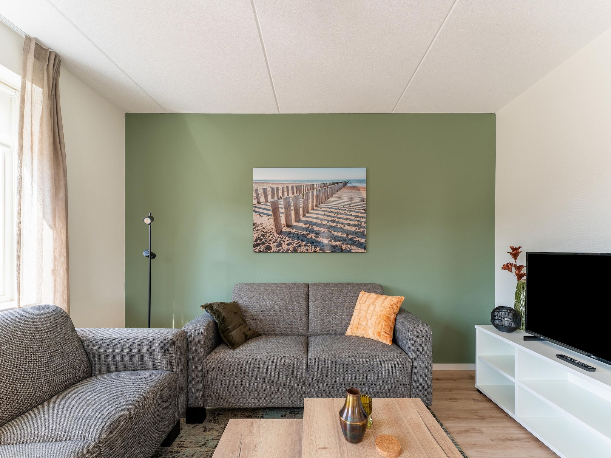 De woonkamer van De Tjiftjaf Huis Nr 21 in Scherpenisse