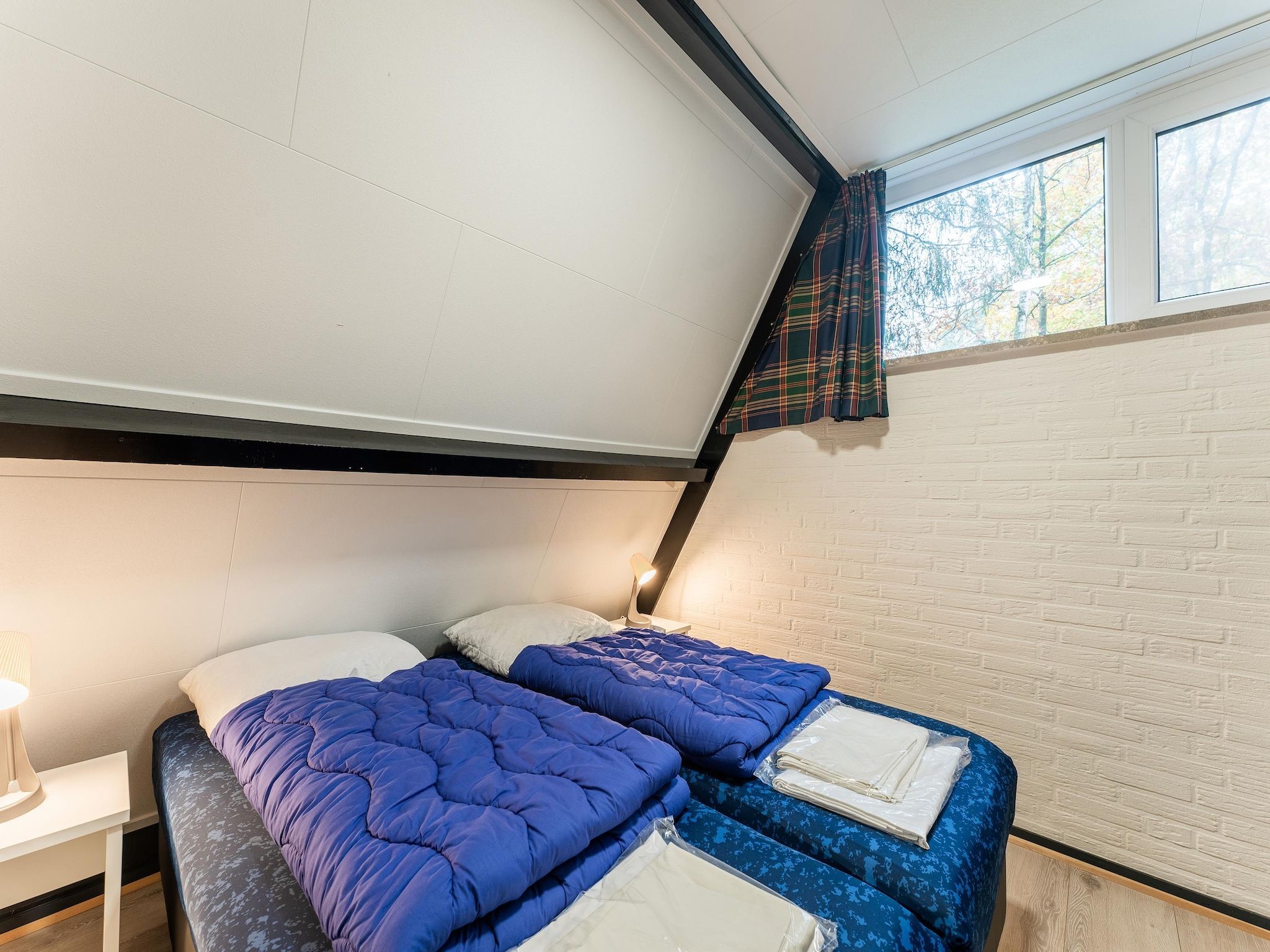 Een slaapkamer van Vosseven 54 Albatros in Stramproy