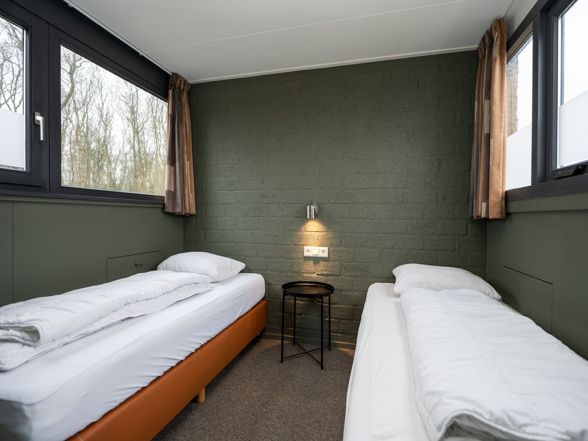 Een slaapkamer van Vakantiepark 't Eibernest Texel 2 in De Cocksdorp