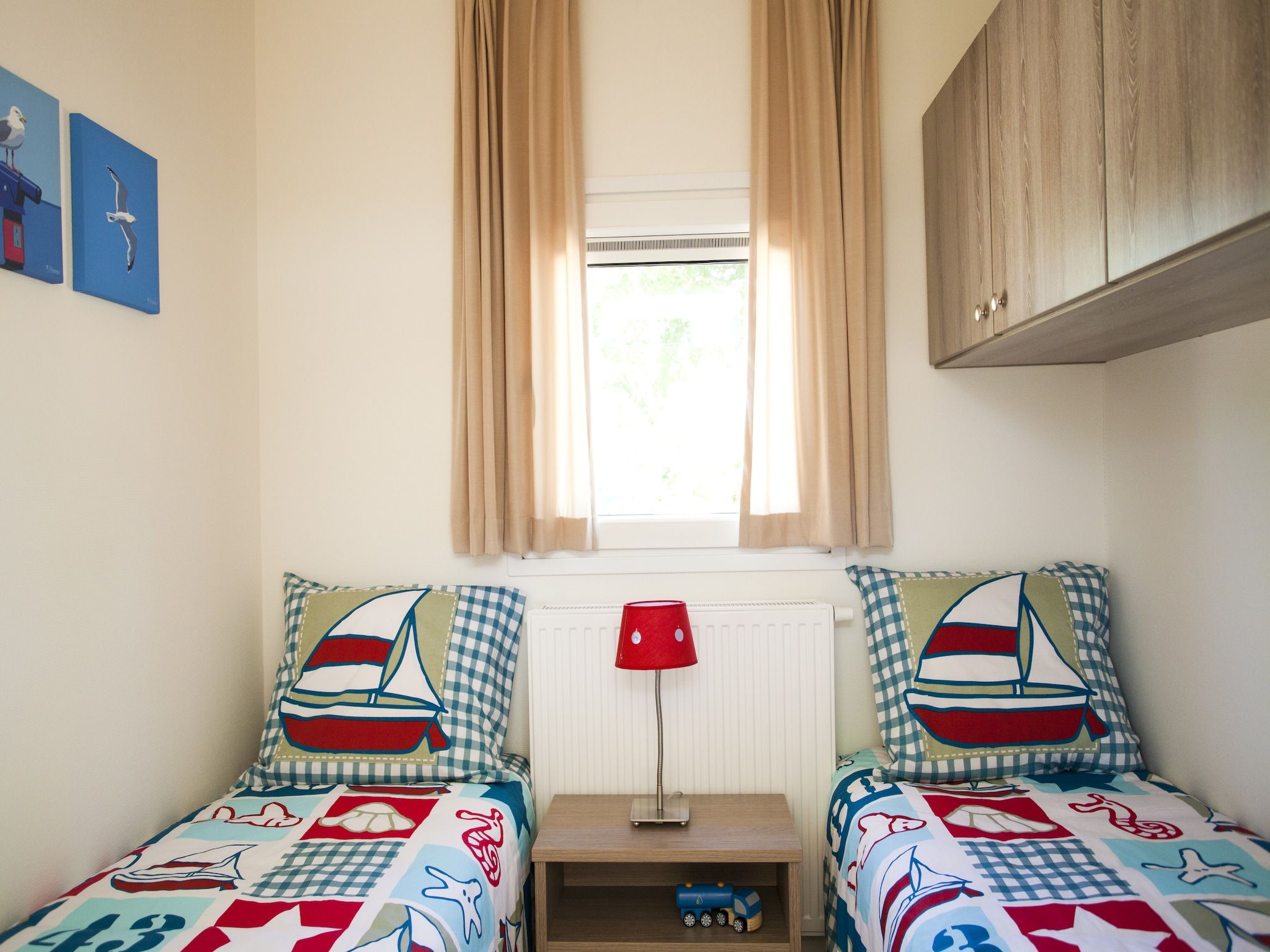 Een slaapkamer van Cabana 4 in Breskens