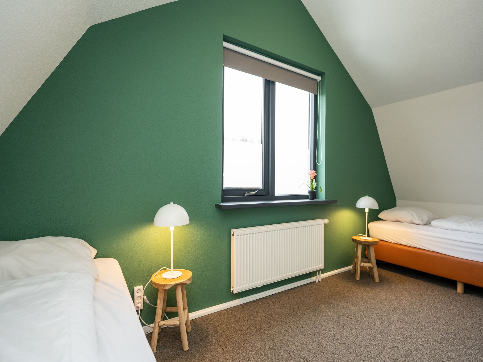 Een slaapkamer van Vakantiepark 't Eibernest Texel 7 in De Cocksdorp