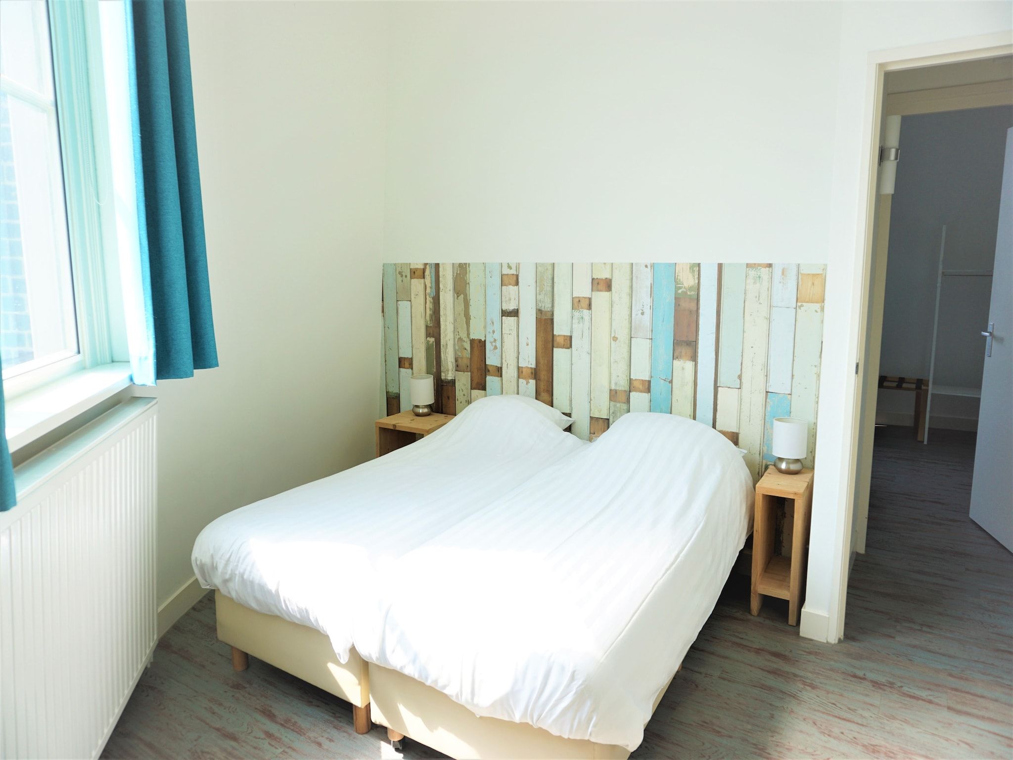 Een slaapkamer van Familiehuis Watertoren 8 pers in Vlissingen