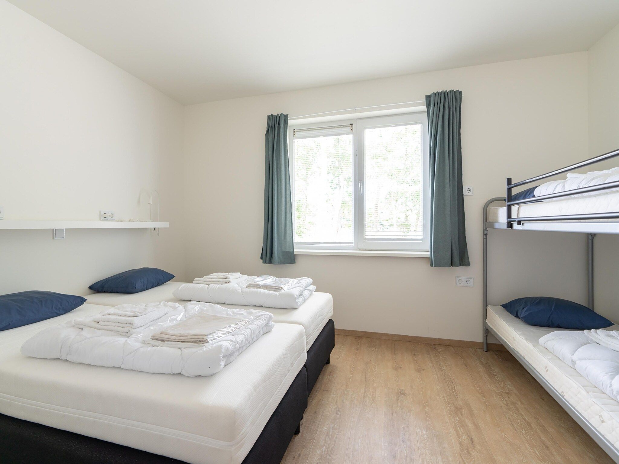 Een slaapkamer van Combi Vrijersduin en Kaapsduin in Nes