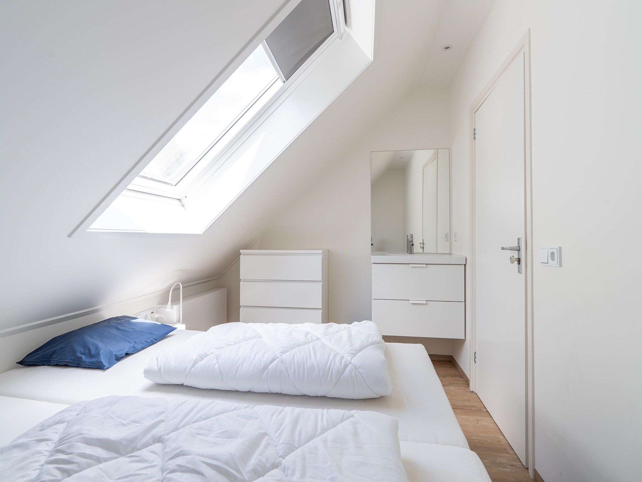 Een slaapkamer van Combi Vrijersduin en Kaapsduin in Nes