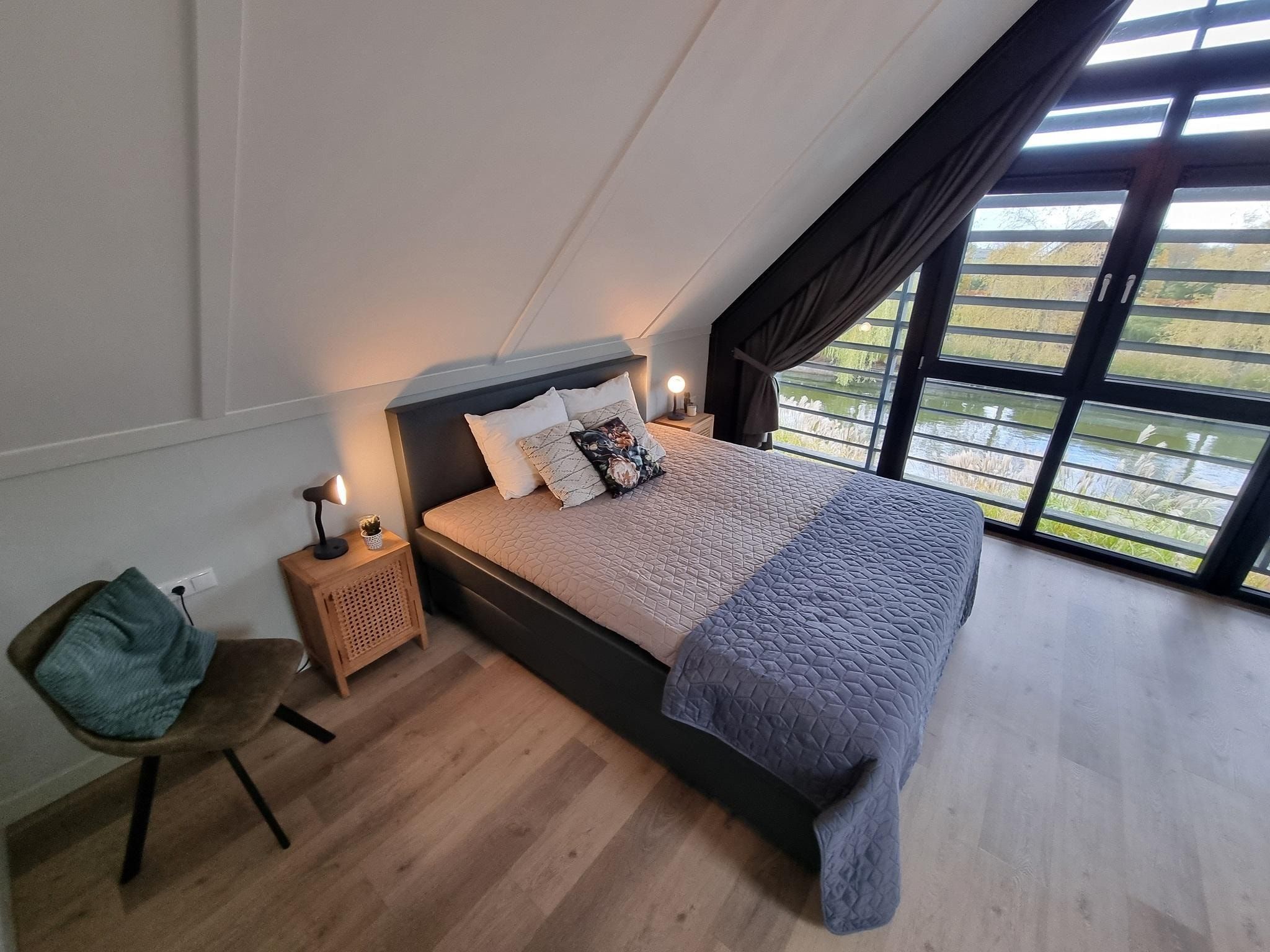 Een slaapkamer van Watervilla Twa in Balk