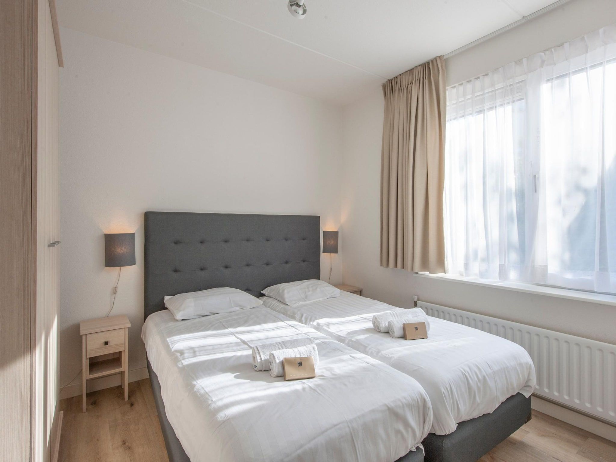 Een slaapkamer van Vakantiepark Zeeland Village 4 in Scharendijke