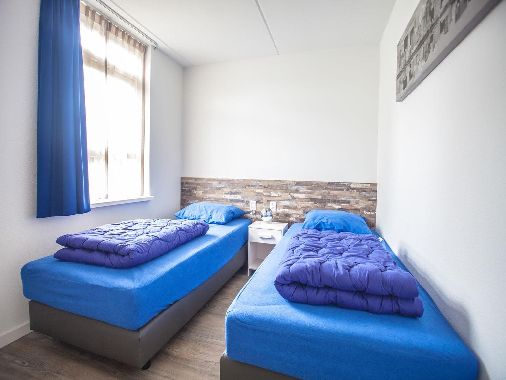 Een slaapkamer van Dijkvilla 6 in Medemblik