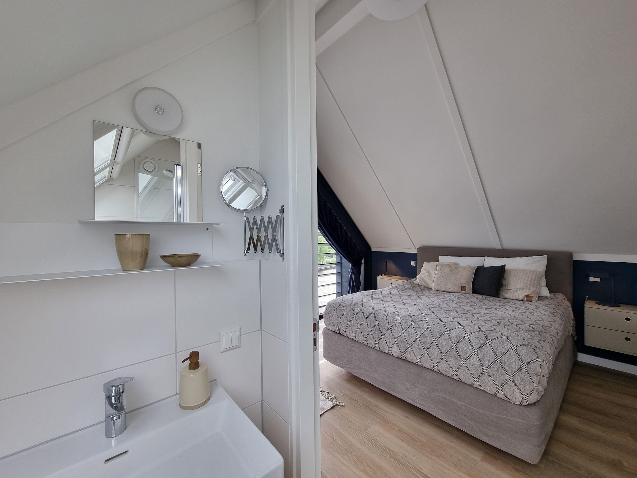 Een slaapkamer van Watervilla Acht in Balk