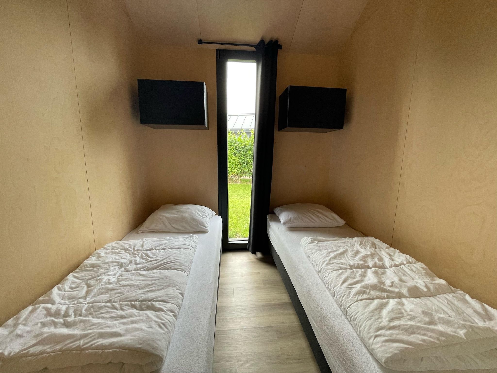 Een slaapkamer van Vakantiepark Eigen Wijze 12 in Bant