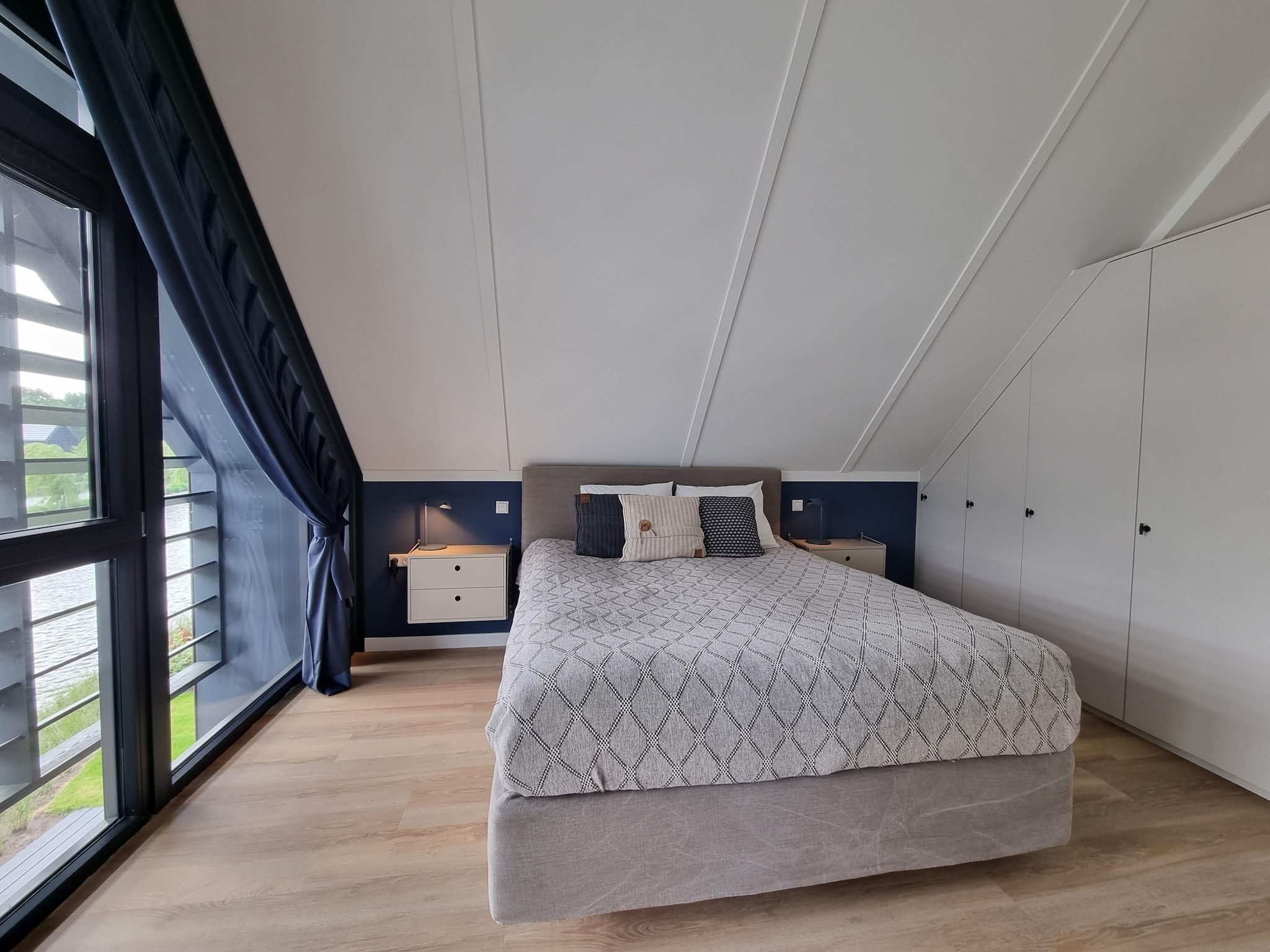 Een slaapkamer van Watervilla Fiiftjin in Balk