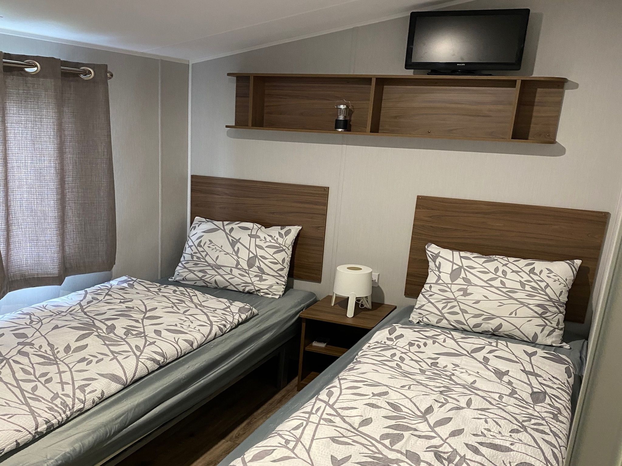 Een slaapkamer van Recreatiepark Rhederlaagse Meren 4 in Lathum