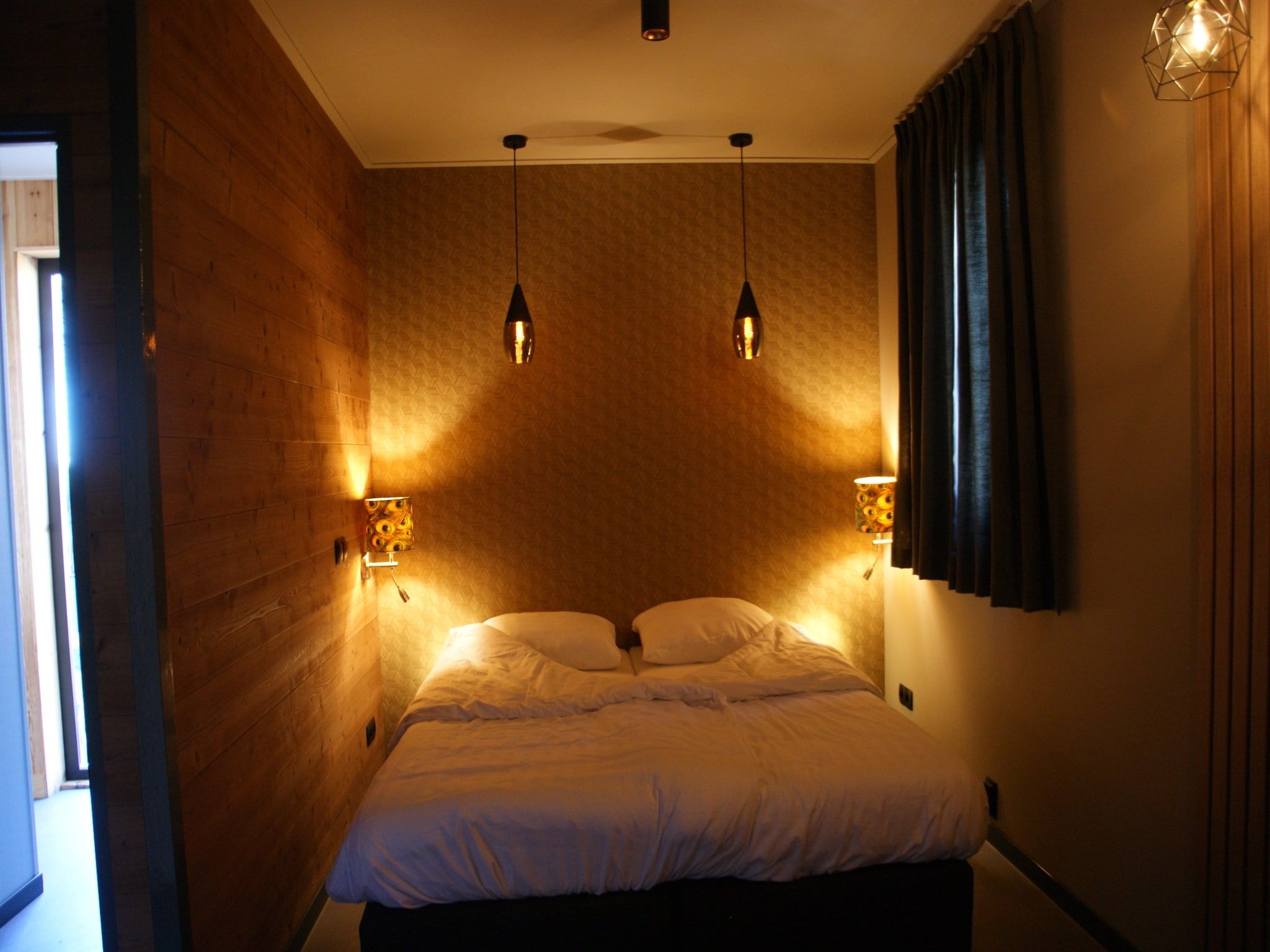 Een slaapkamer van Wellnesslodge Kievit 2p in Dalerveen