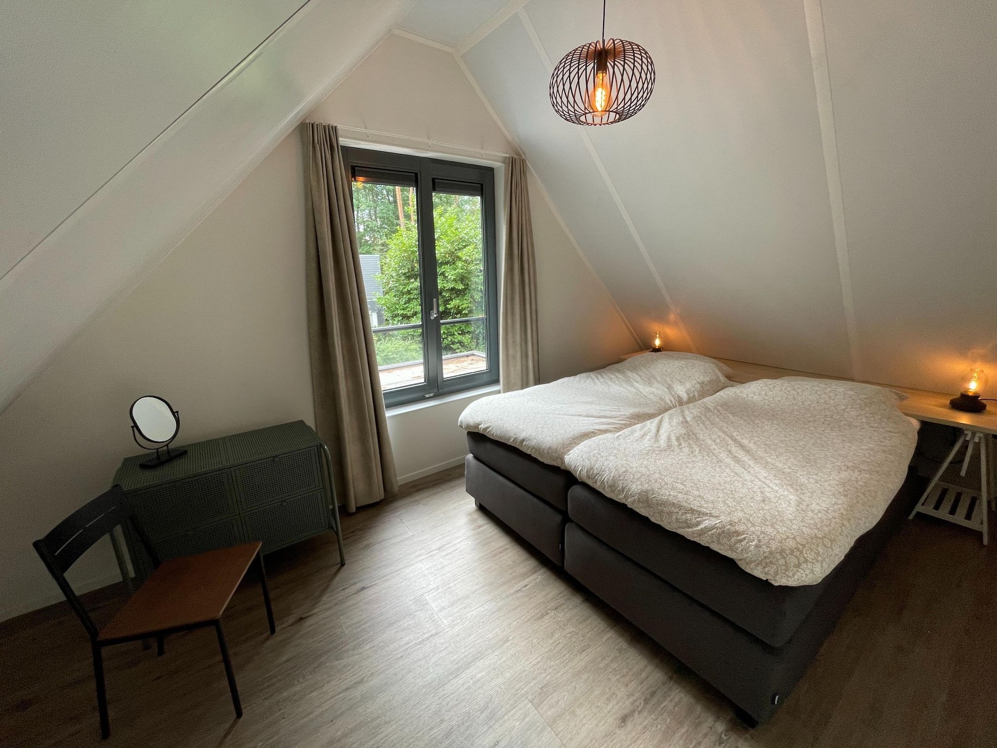 Een slaapkamer van Energievriendelijk 't Brummelhuus H556 in Lochem