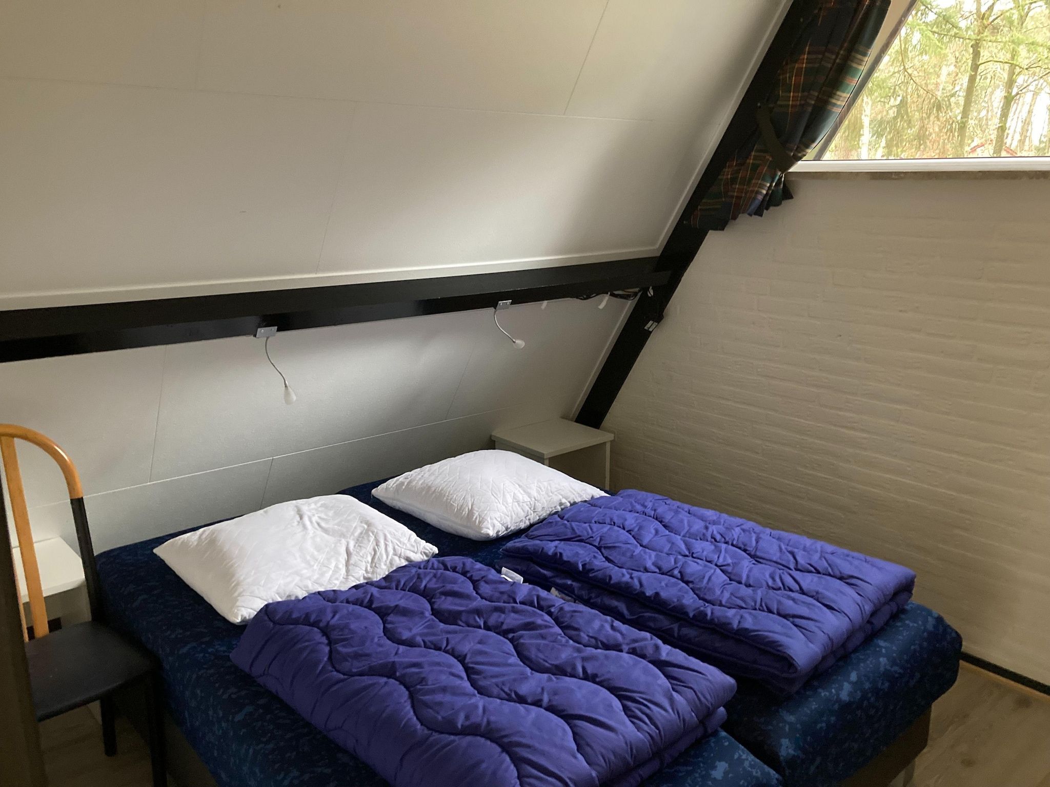 Een slaapkamer van Vosseven 73 Maretak in Stramproy