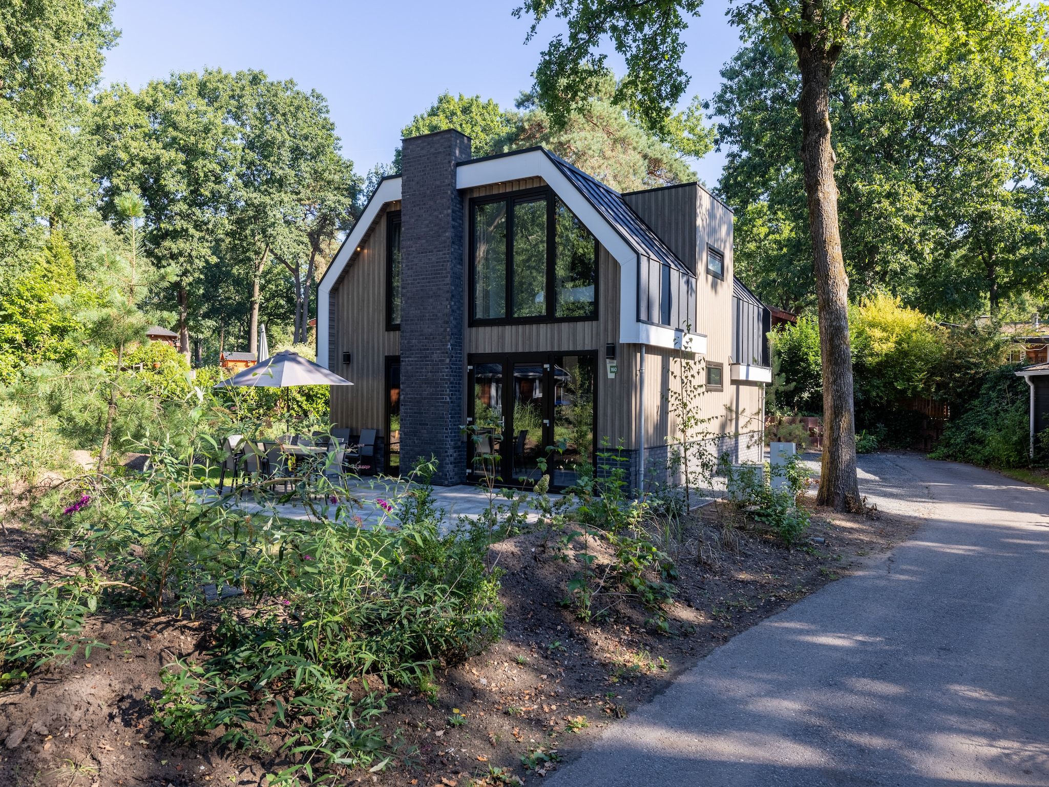 De buitenkant van Vakantiepark De Rimboe & De Woeste Hoogte 38 in Hoenderloo