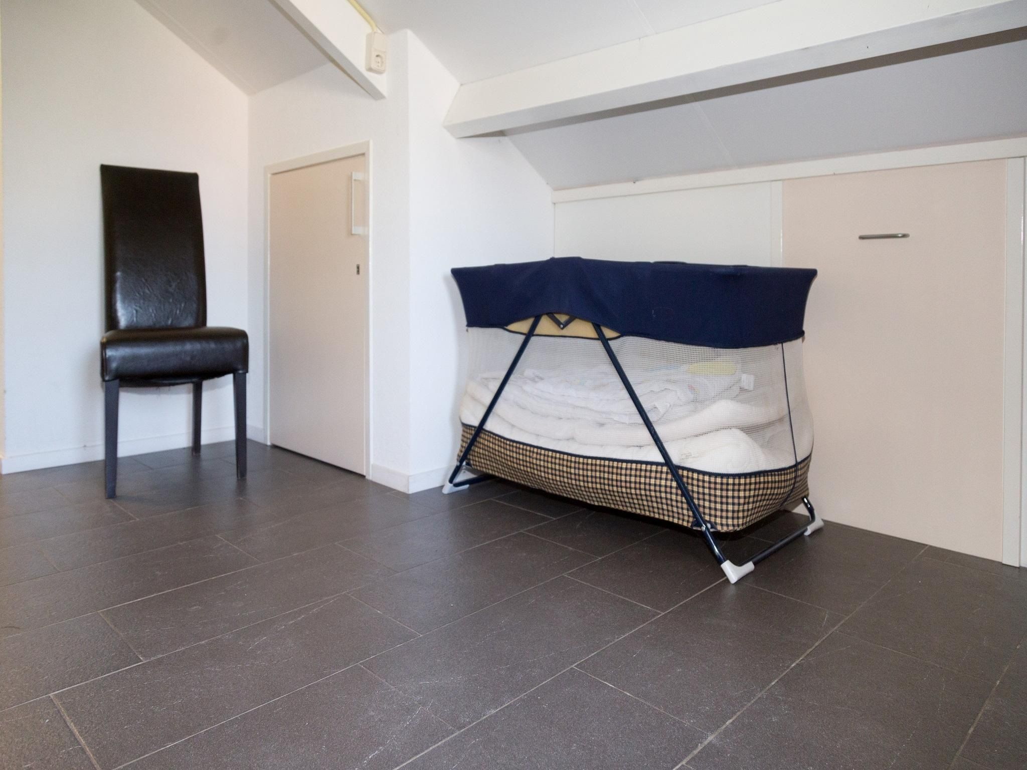 Een slaapkamer van Strandwoning Baarland in Zeeland in Baarland