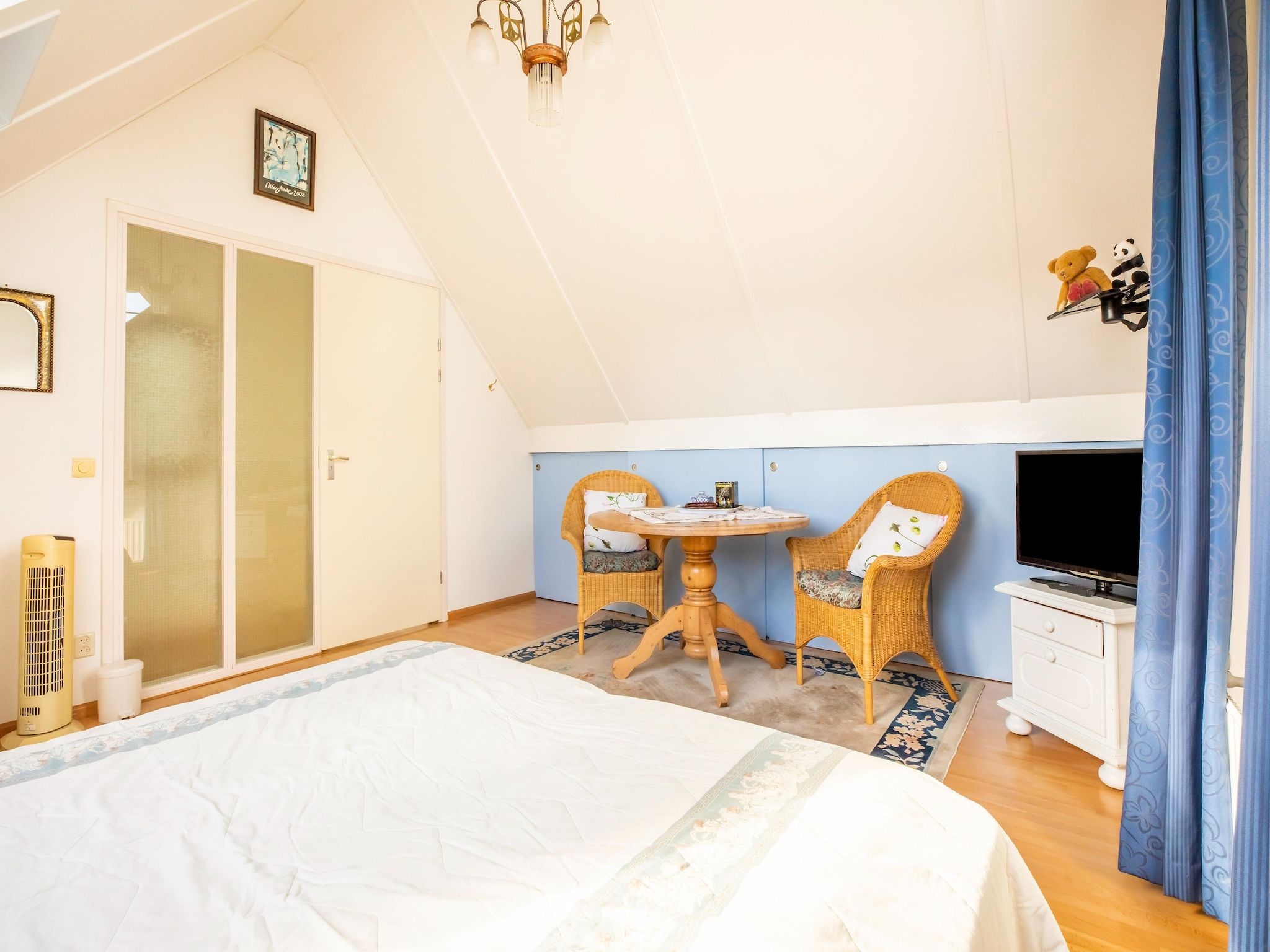 Een slaapkamer van Vakantiewoning Blauw in Hoorn