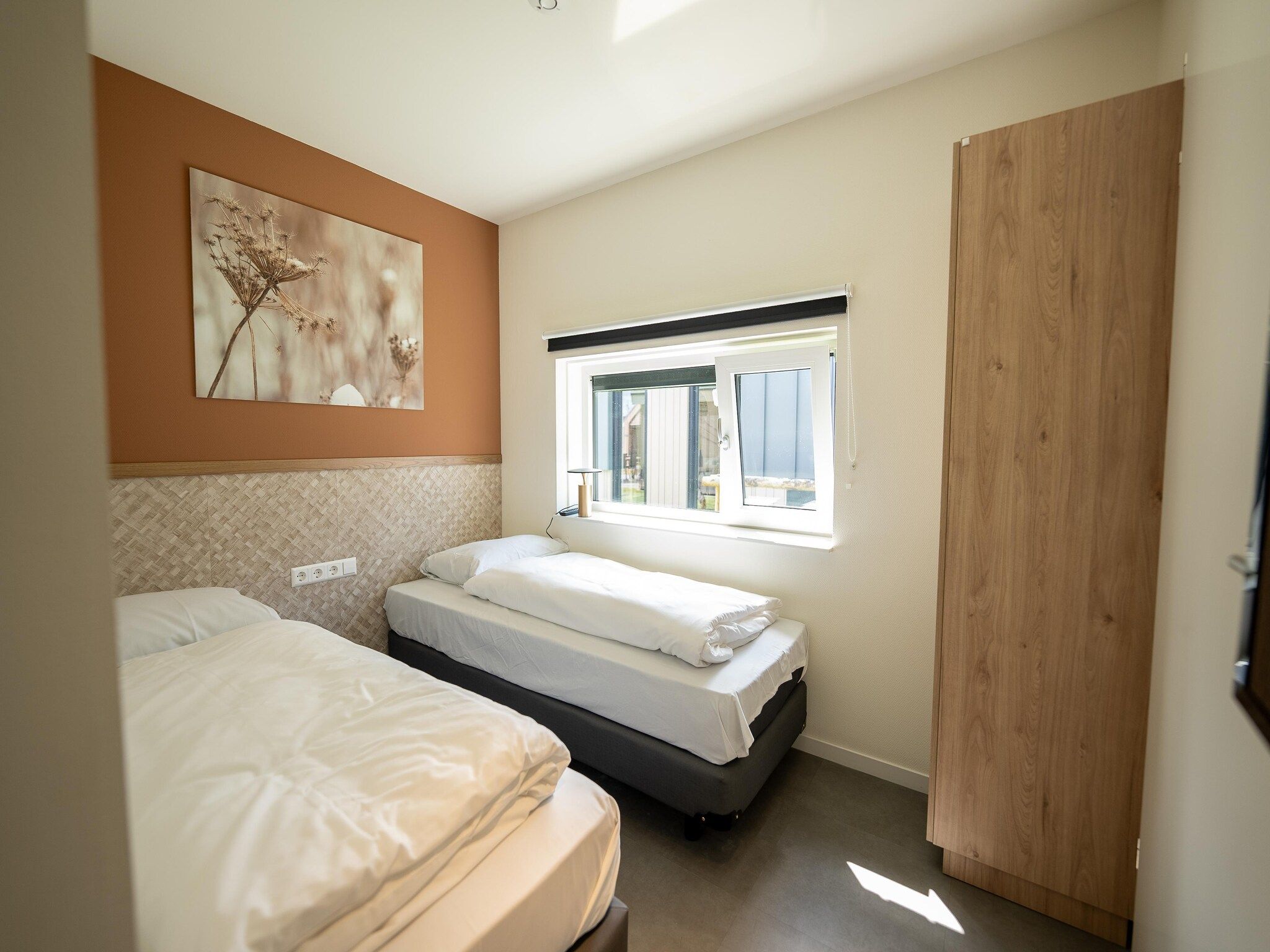 Een slaapkamer van Vakantiepark Zeebad 15 in Breskens