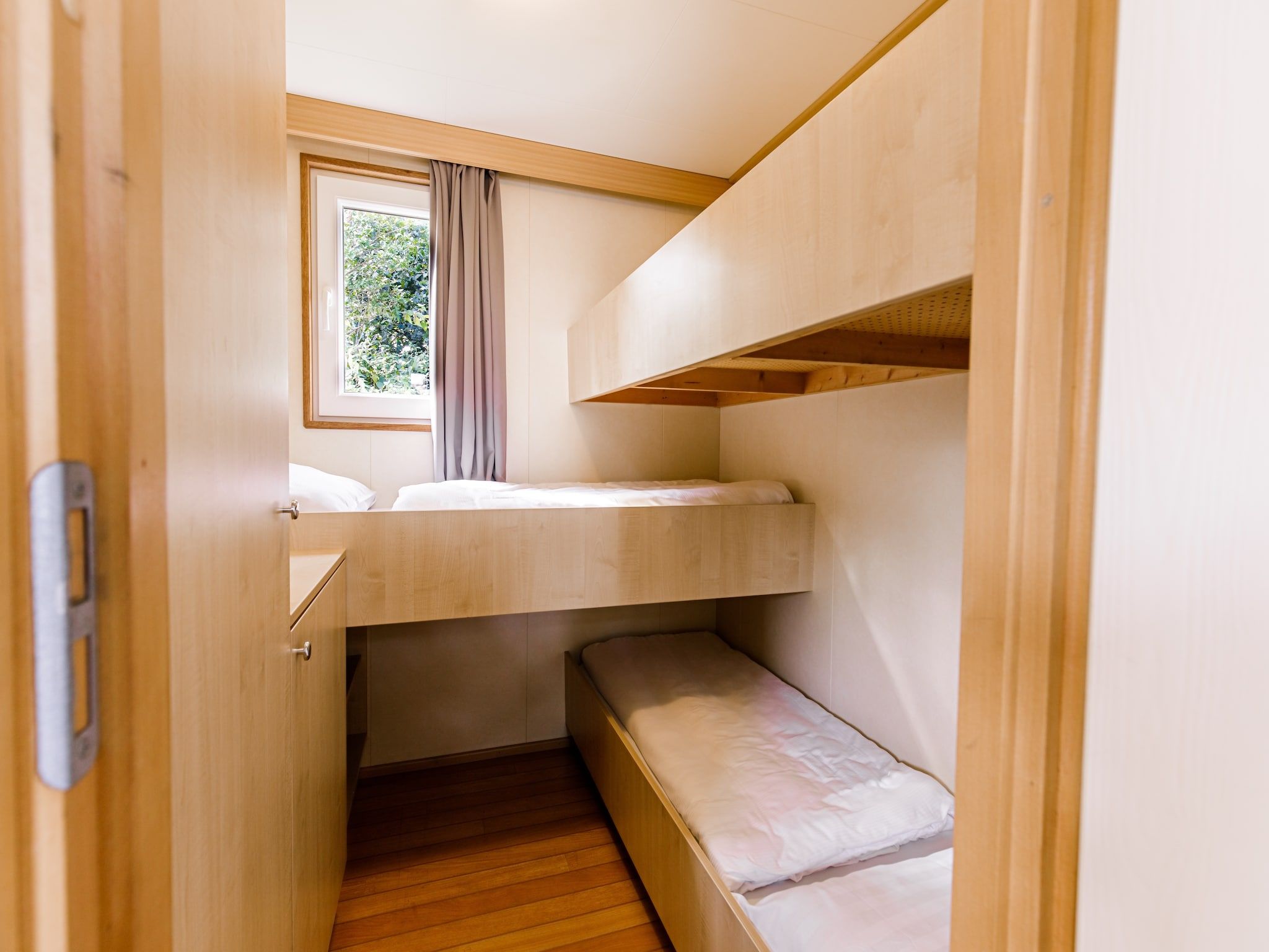 Een slaapkamer van Vakantiepark Leukermeer 1 in Well
