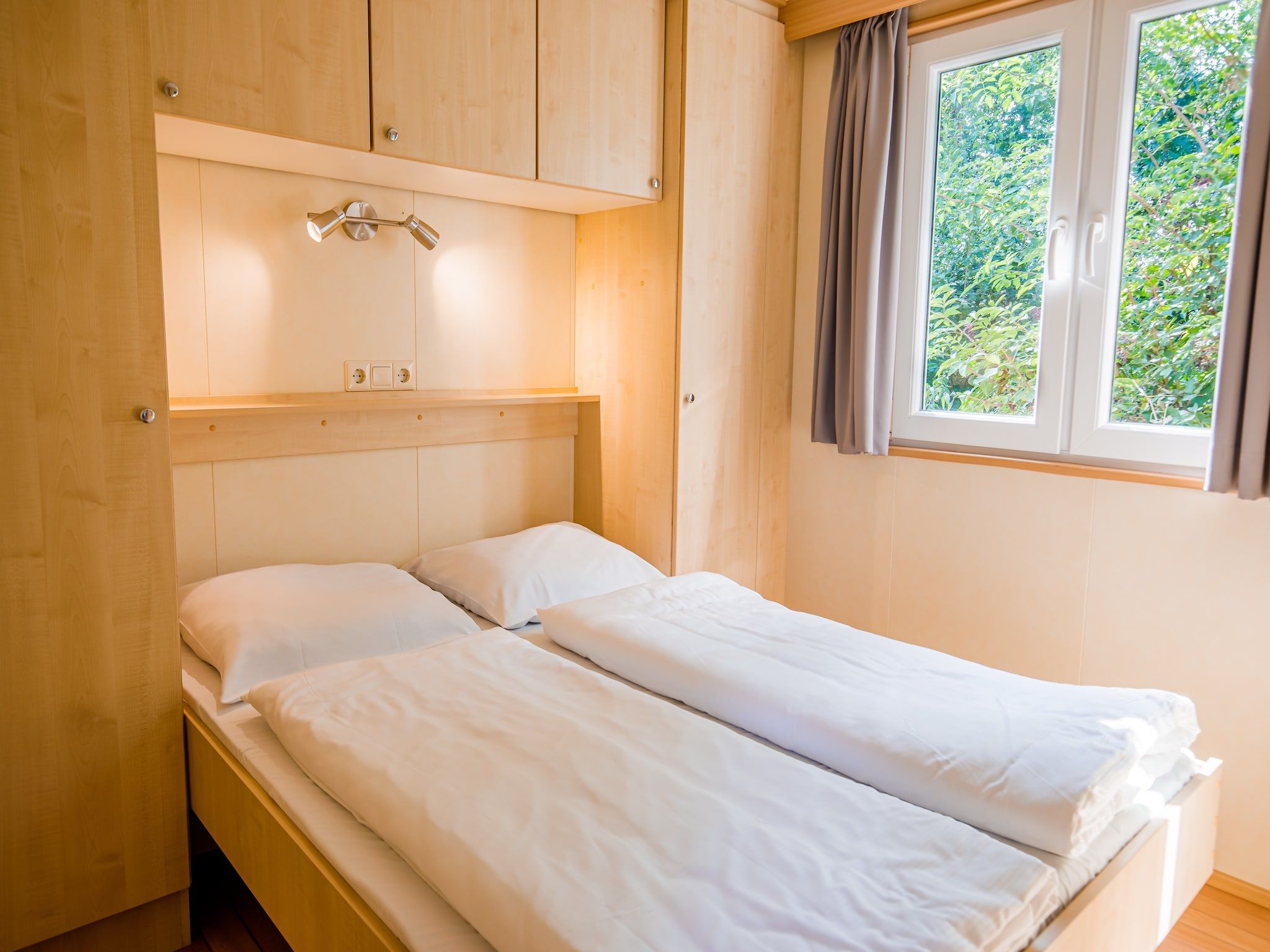 Een slaapkamer van Vakantiepark Leukermeer 4 in Well