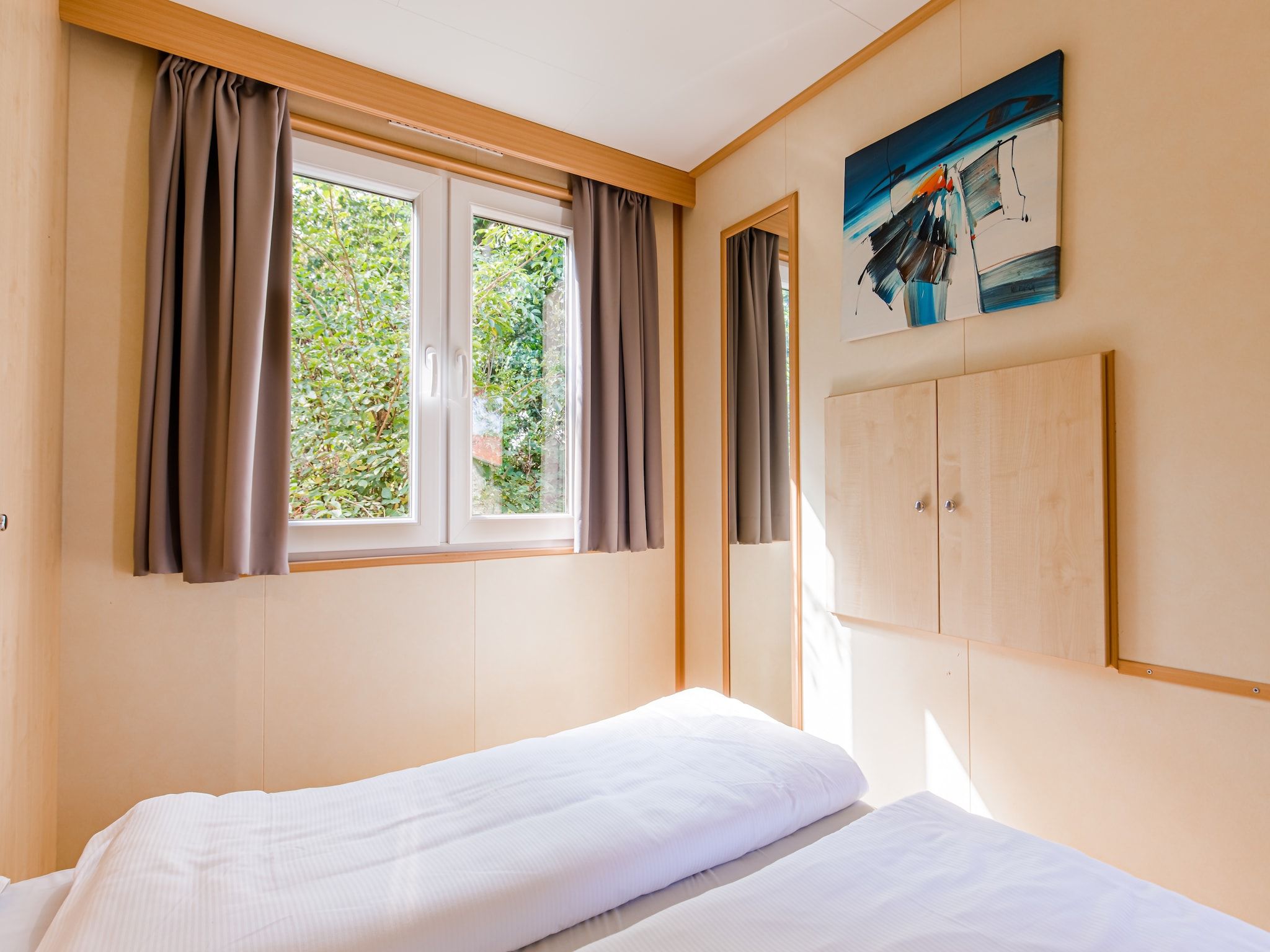 Een slaapkamer van Vakantiepark Leukermeer 5 in Well