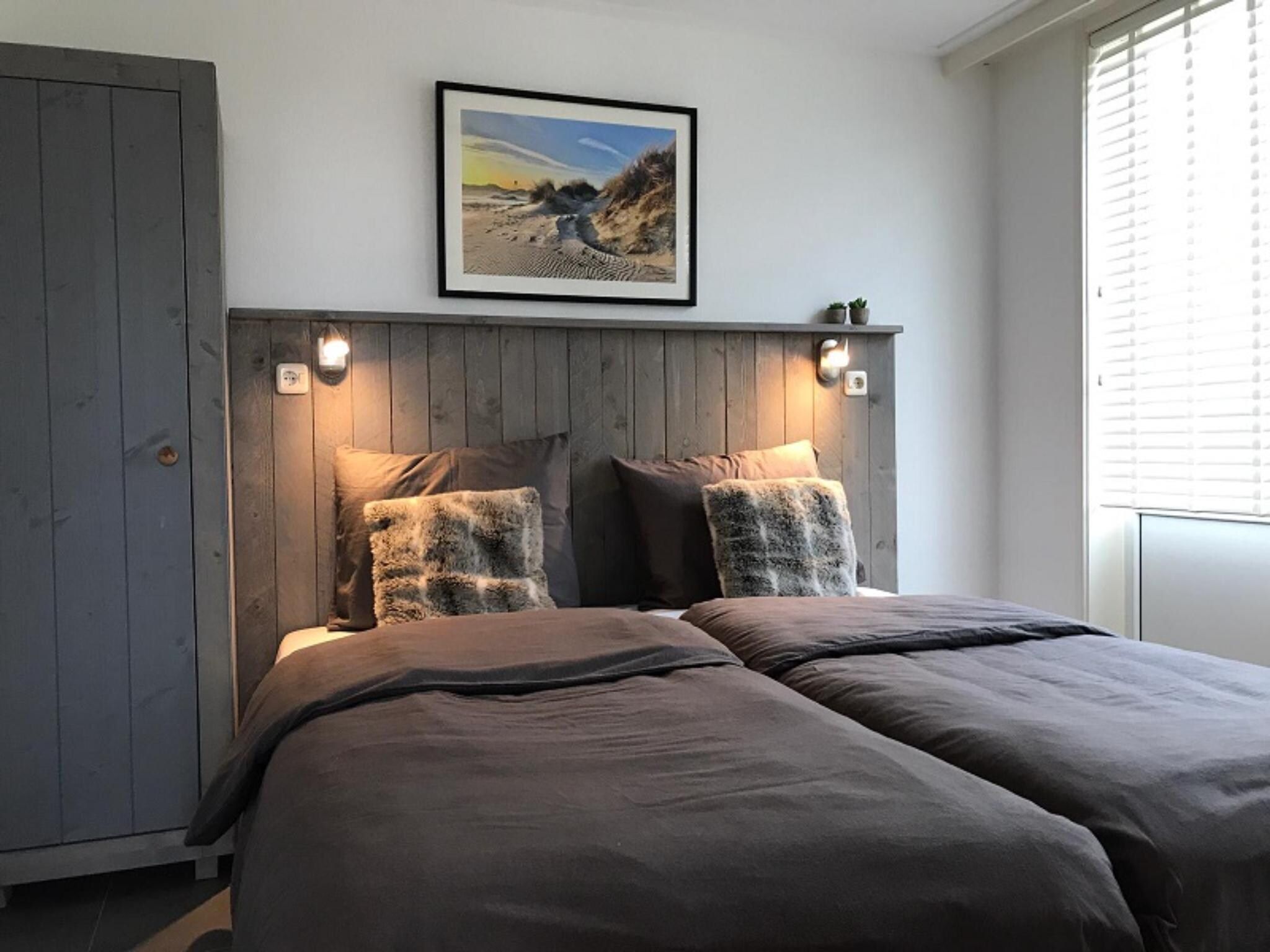 Een slaapkamer van Golfvilla 39 Wellness in Hollum