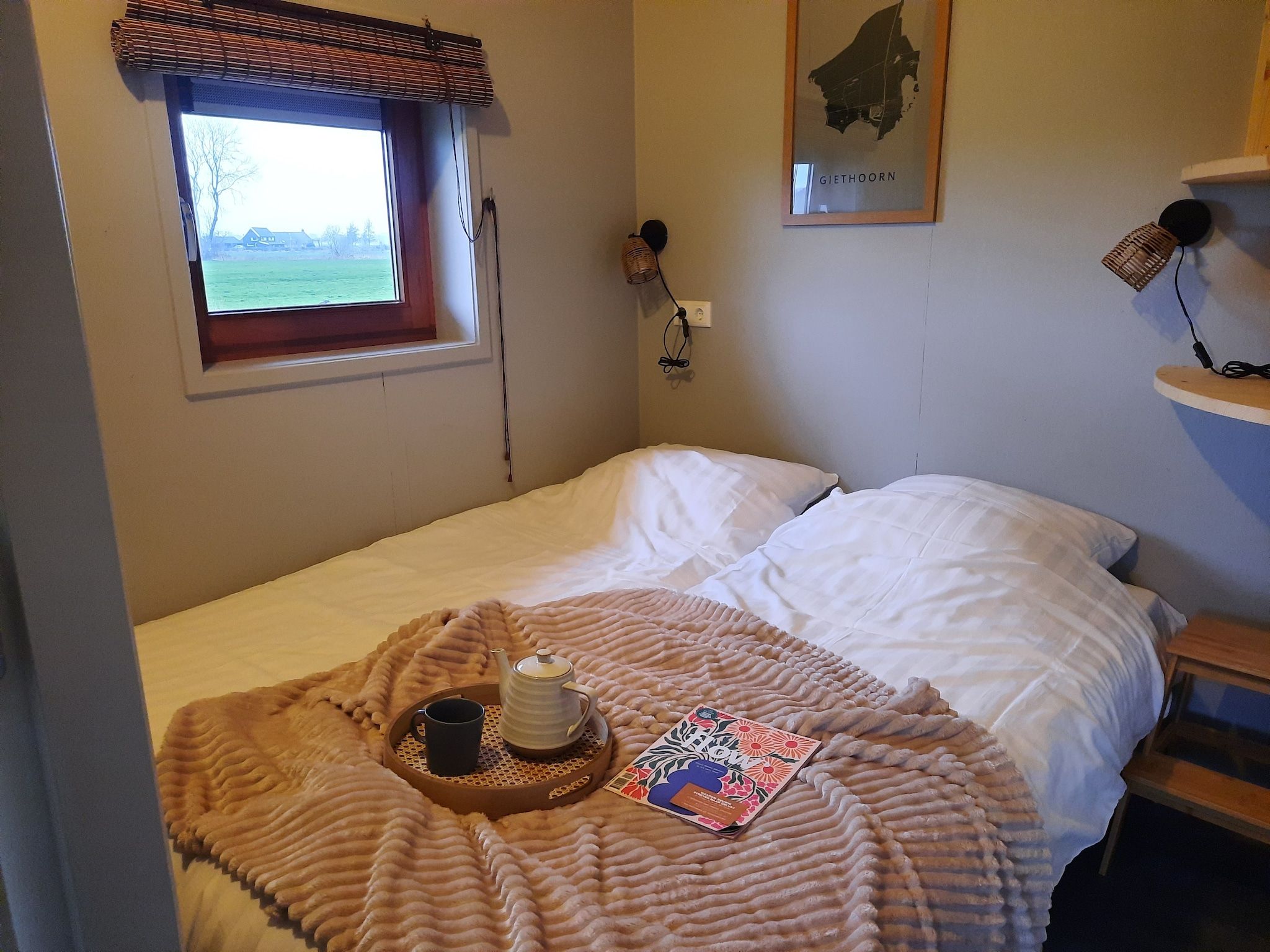 Een slaapkamer van Acker Lodges 2 in Ruinerwold