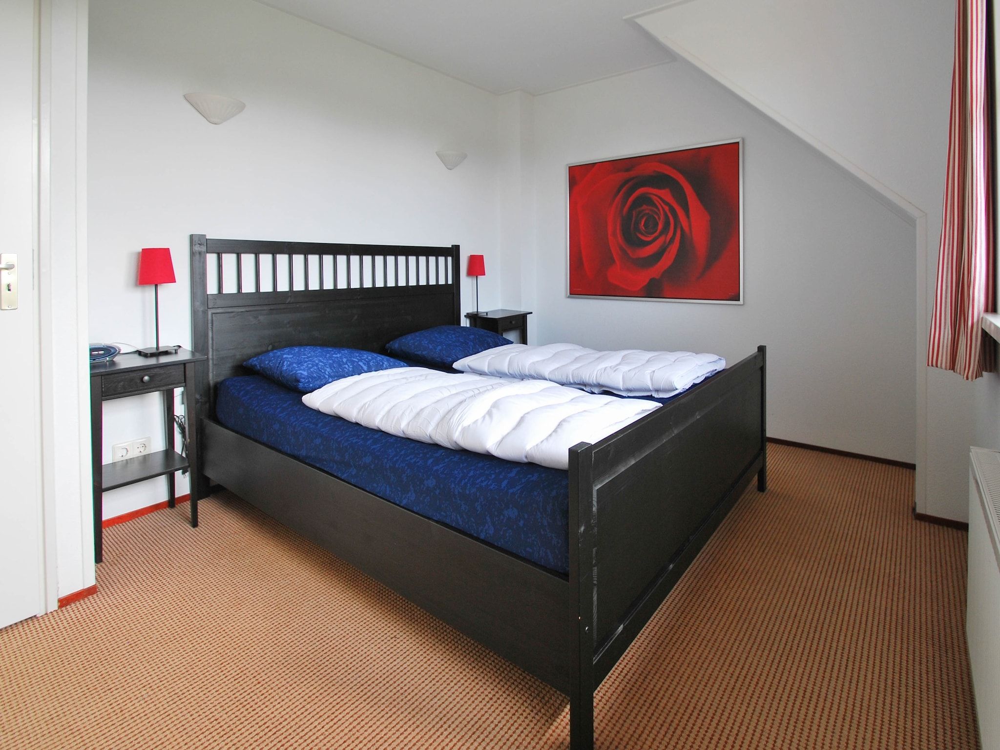 Een slaapkamer van Duinvilla - 6 personen in Makkum