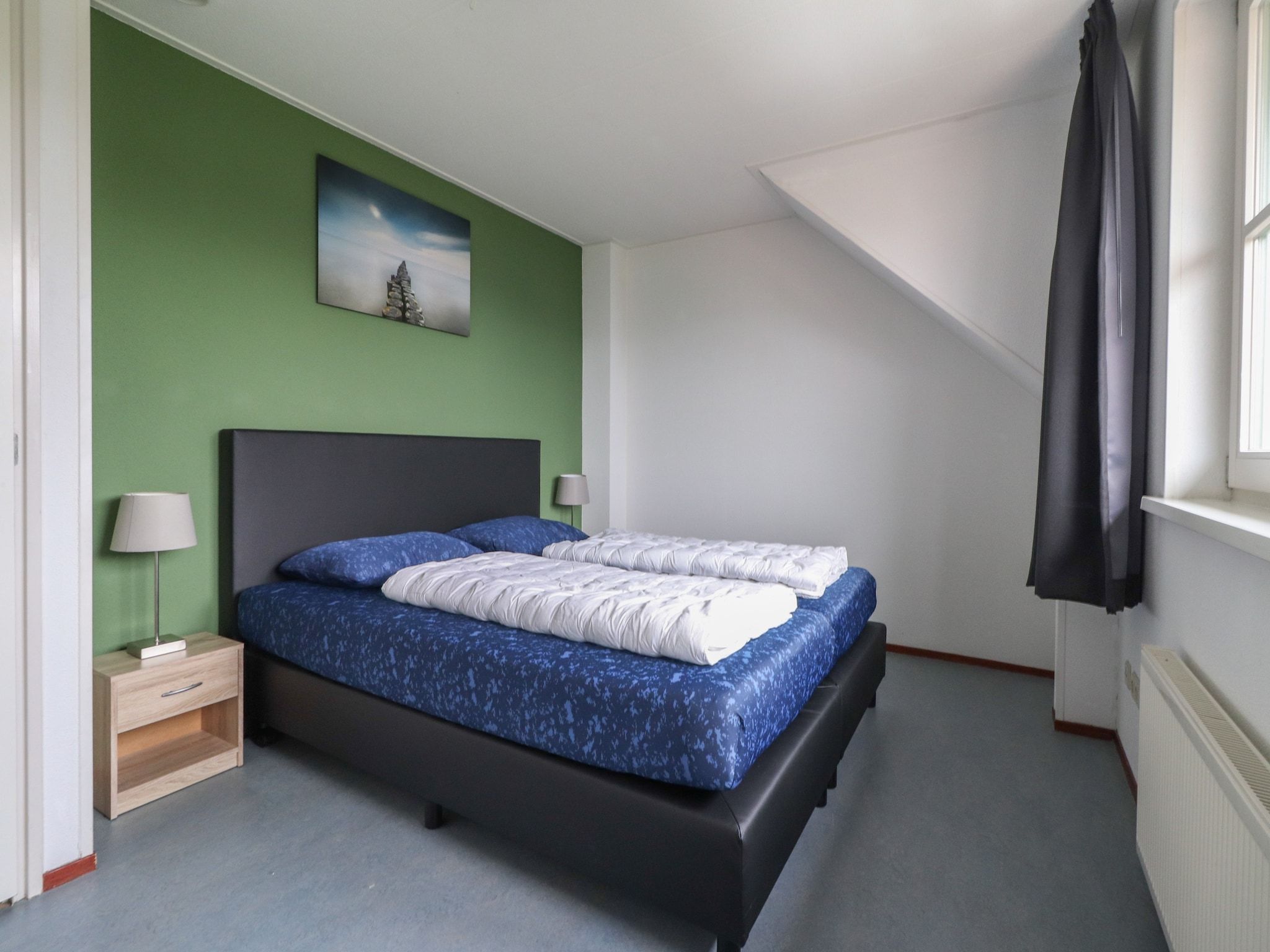 Een slaapkamer van Duinvilla - 6 personen in Makkum