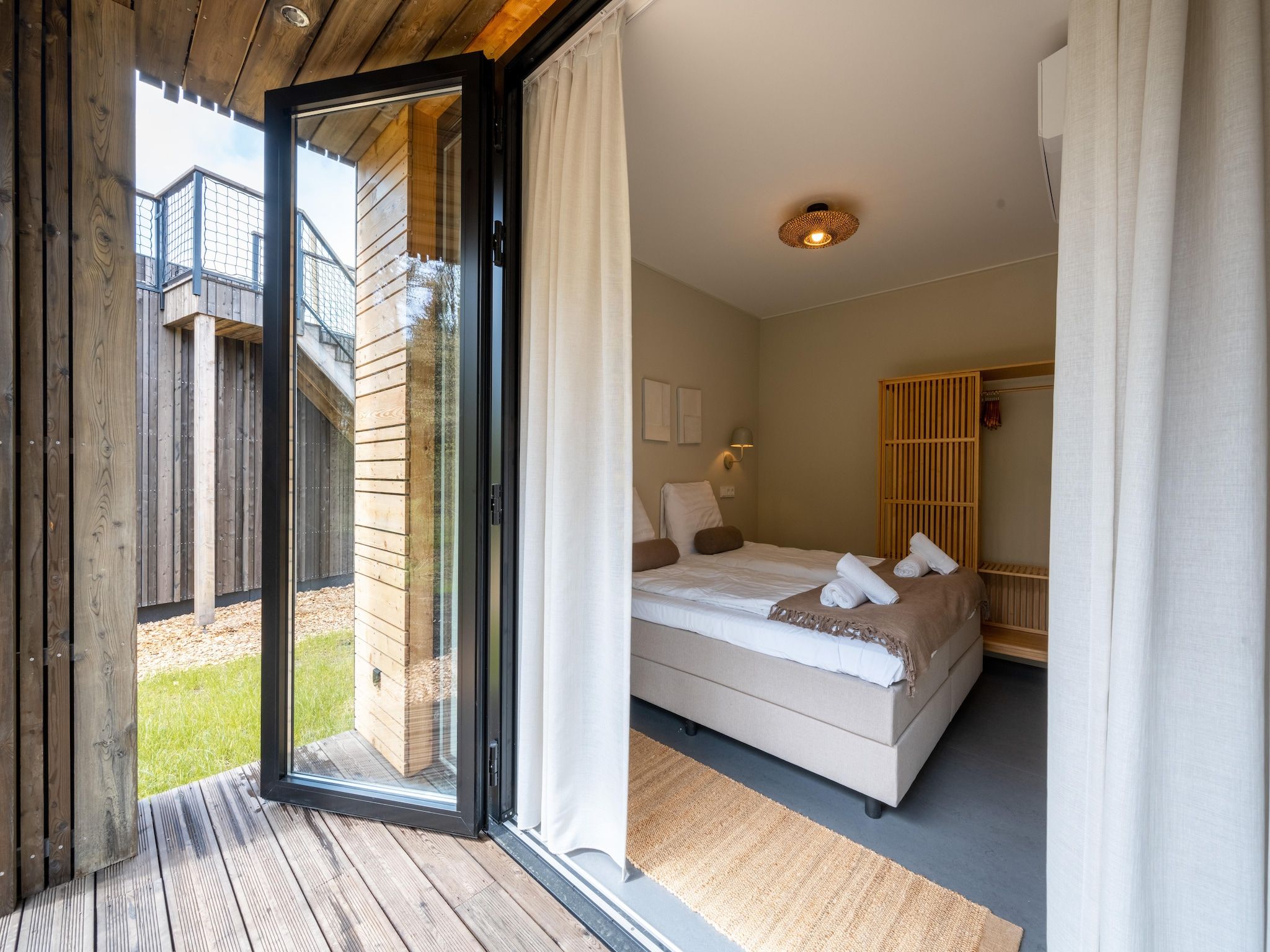 Een slaapkamer van Resort de Parel 5 in Zeewolde