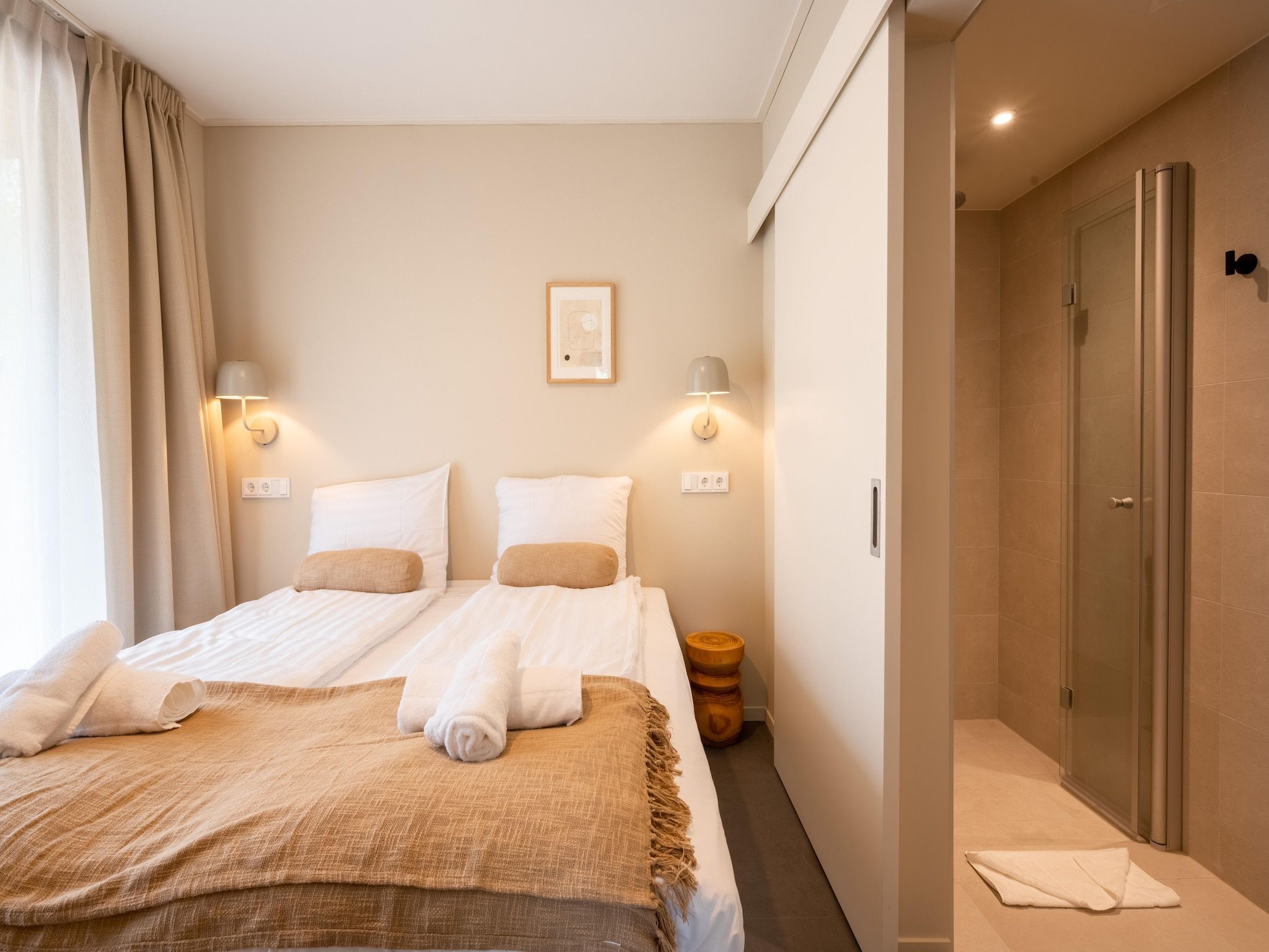 Een slaapkamer van Resort de Parel 13 in Zeewolde