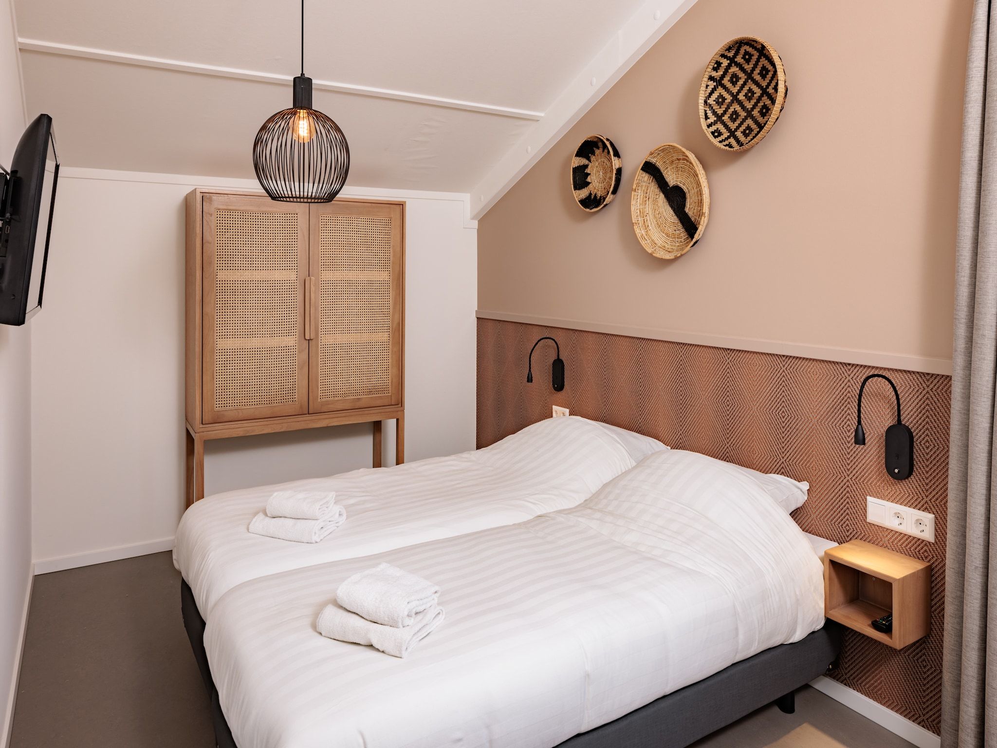 Een slaapkamer van Duinresort Dunimar 4 in Noordwijkerhout