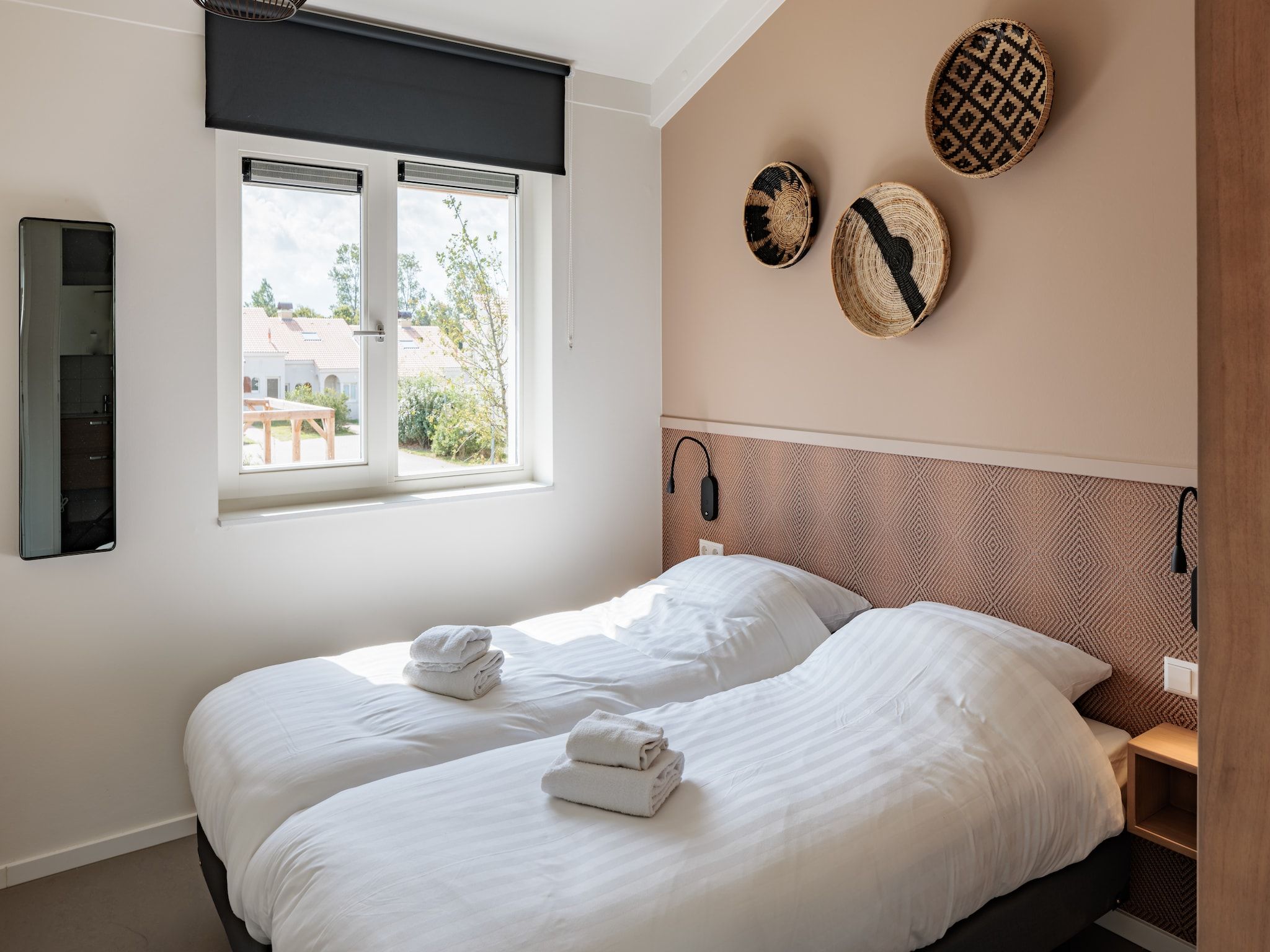 Een slaapkamer van Duinresort Dunimar 5 in Noordwijkerhout