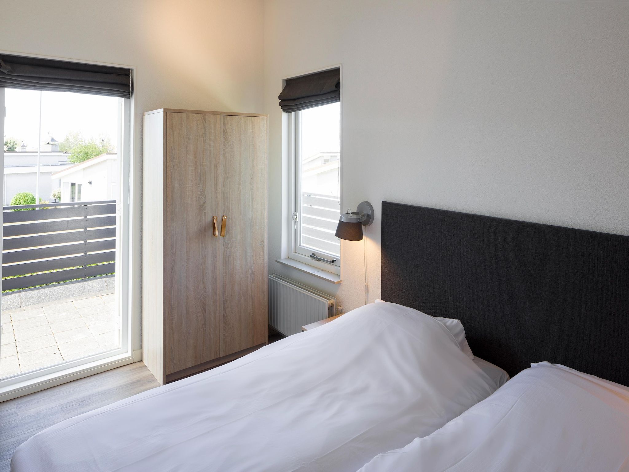 Een slaapkamer van Roompot Beach Resort 25 in Kamperland