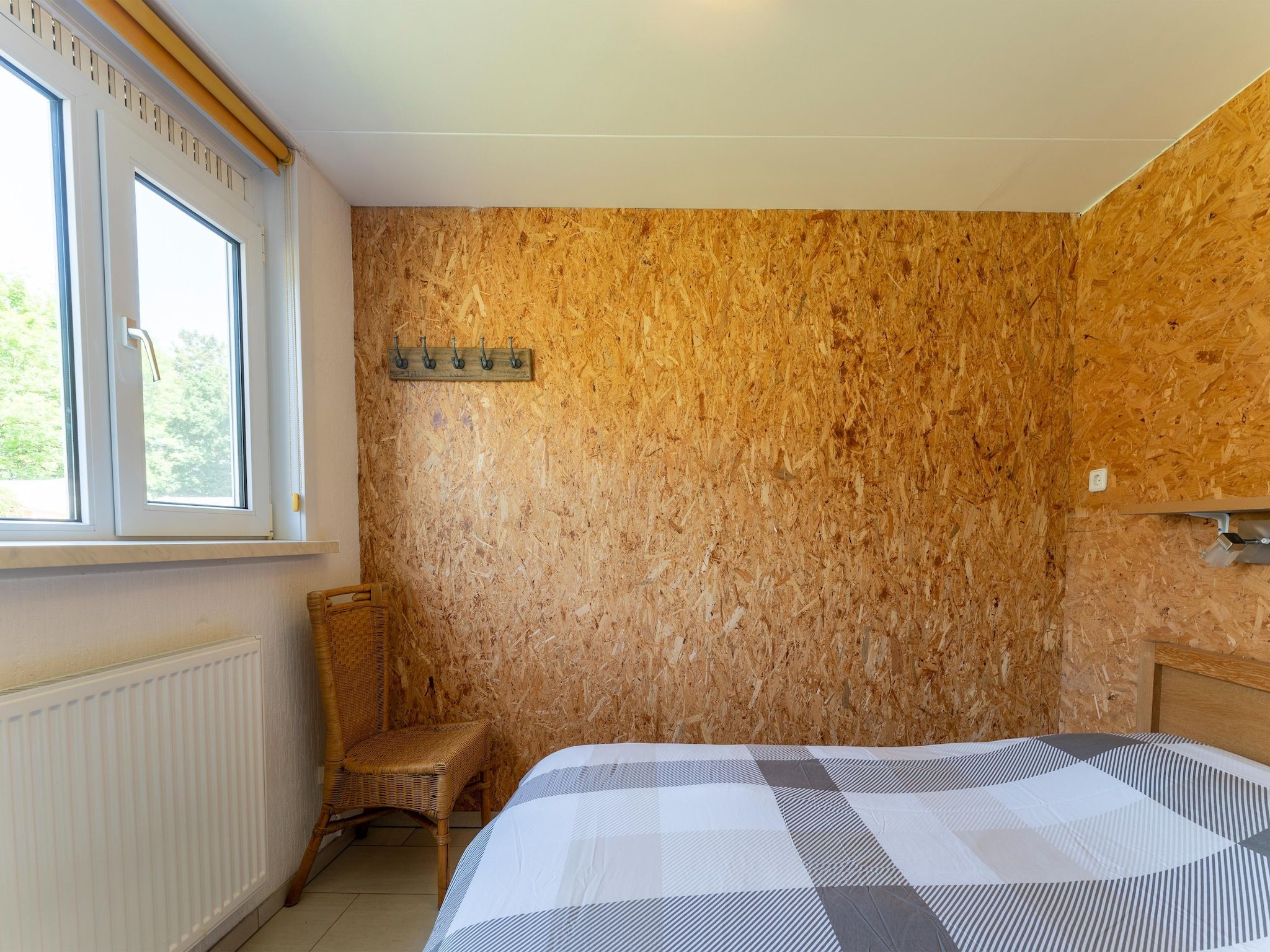 Een slaapkamer van Landingsweg 94 in Baarland