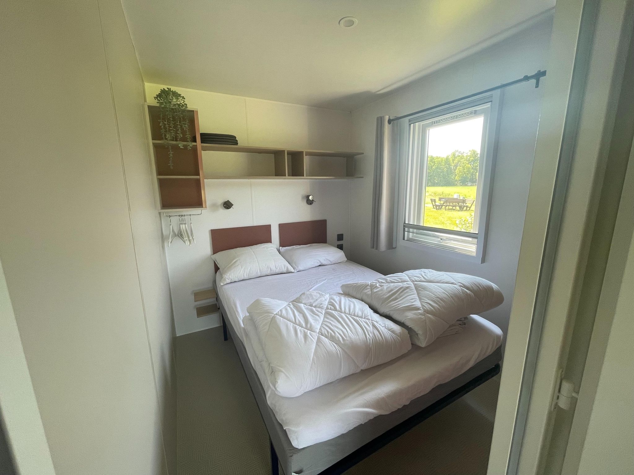 Een slaapkamer van Elperhof Veldlodge in Schoonloo