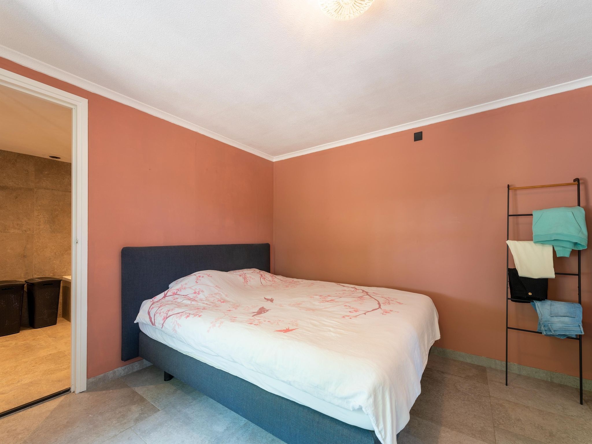 Een slaapkamer van Vakantiewoning de Zwaluw in Eibergen
