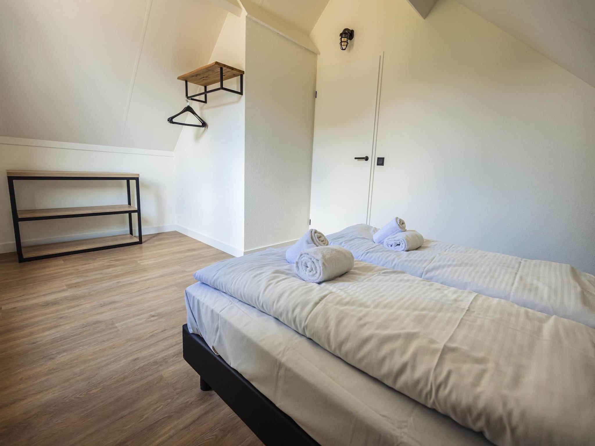 Een slaapkamer van Vakantiepark 't Broeckhuys 8 in Ewijk