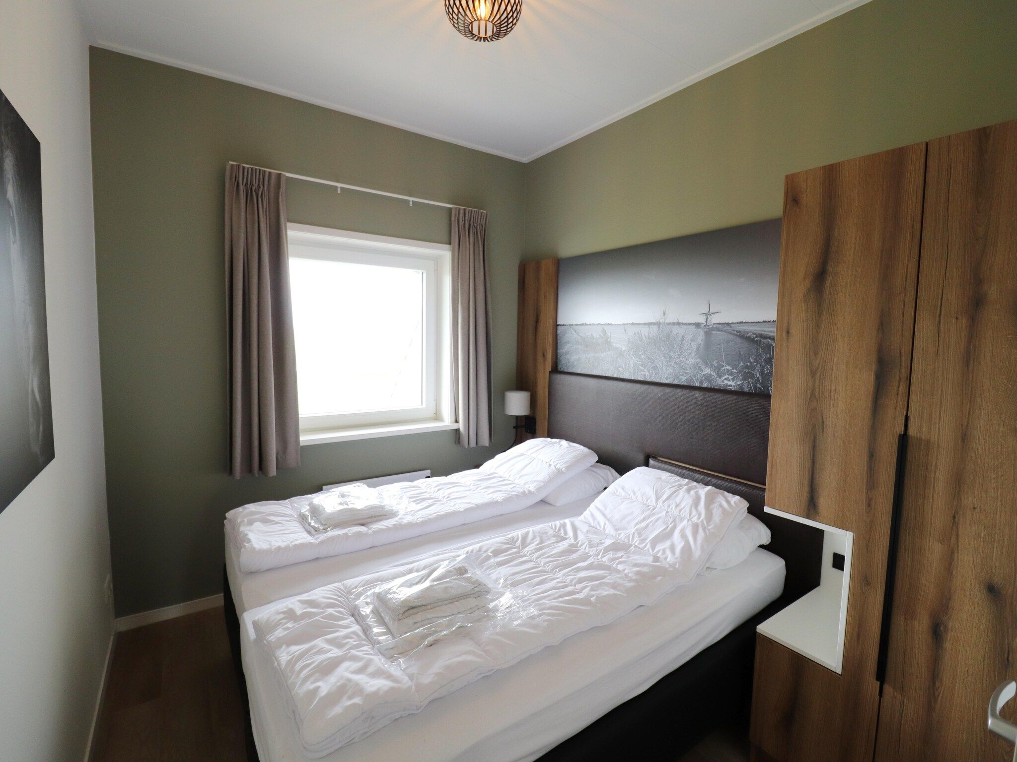 Een slaapkamer van Friese Villa 6 pers met sloep optioneel bij te boeken in Leons