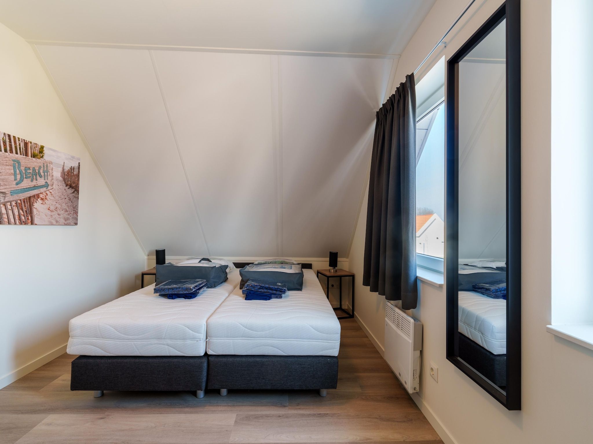 Een slaapkamer van Kuifduiker 124 in Simonshaven