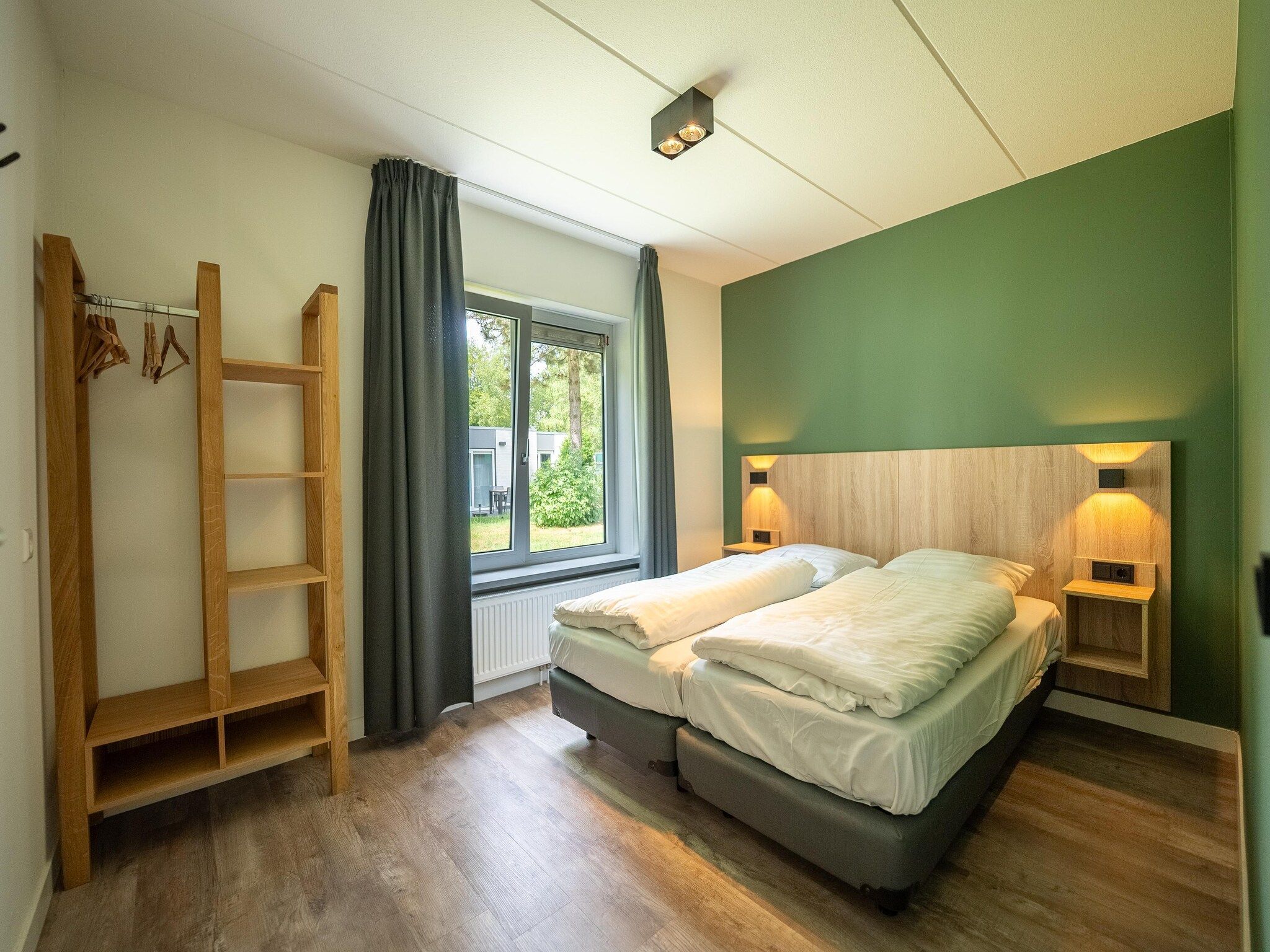 Een slaapkamer van Vakantiepark Hunzedal 19 in Borger