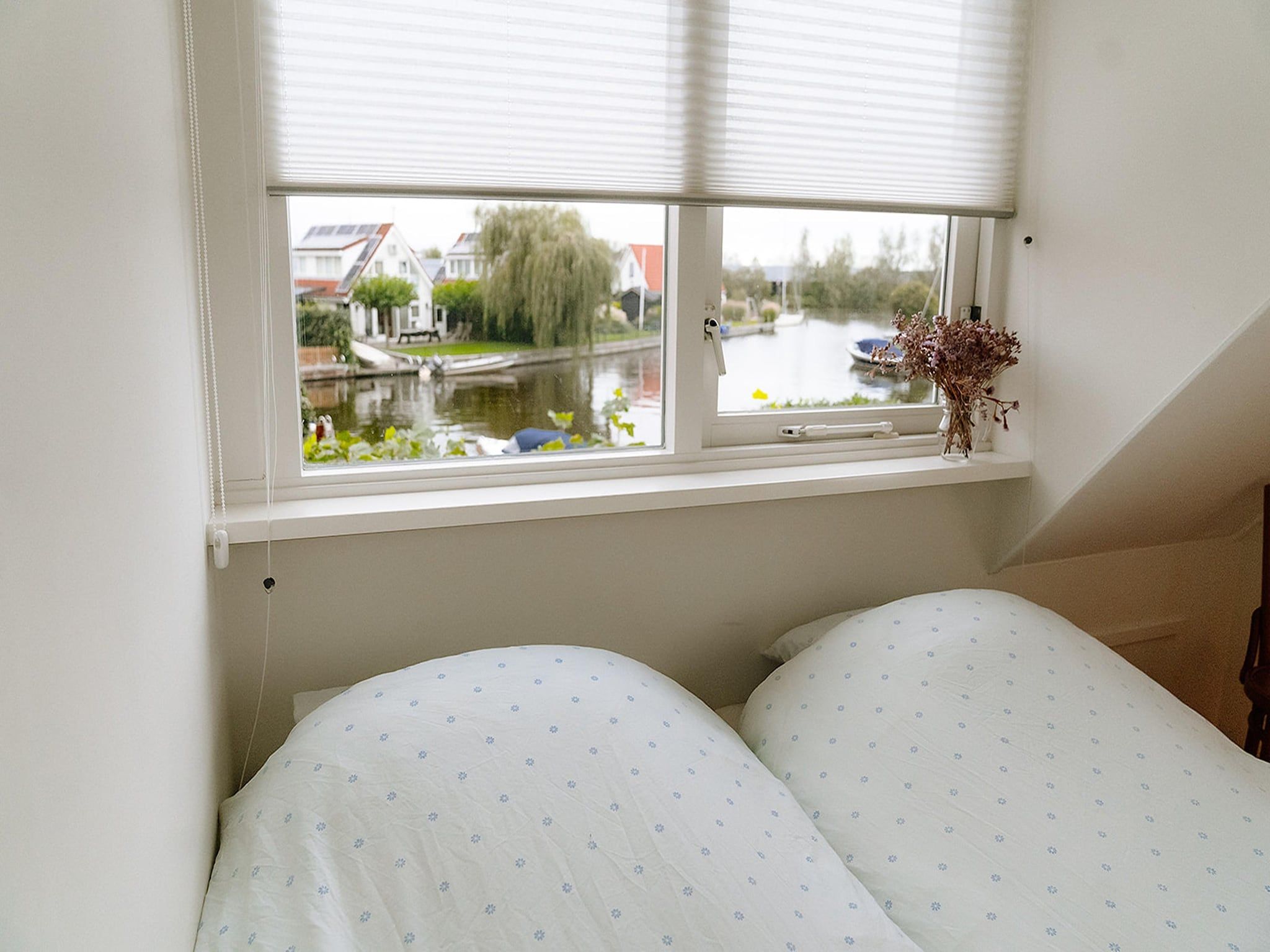 Een slaapkamer van De Wetterkant in Grou