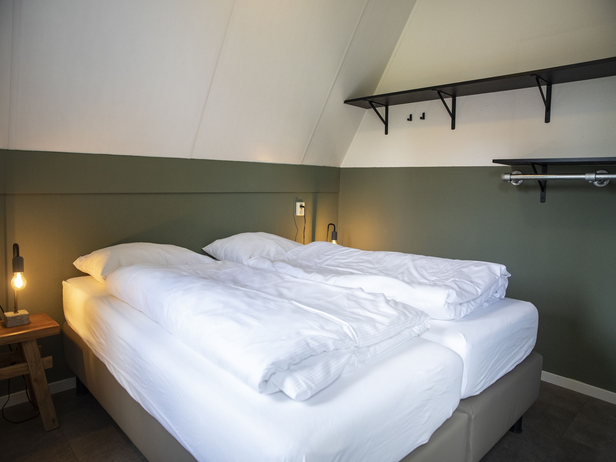 Een slaapkamer van Vakantie bij Meeussen - Molendal 4 in Plasmolen